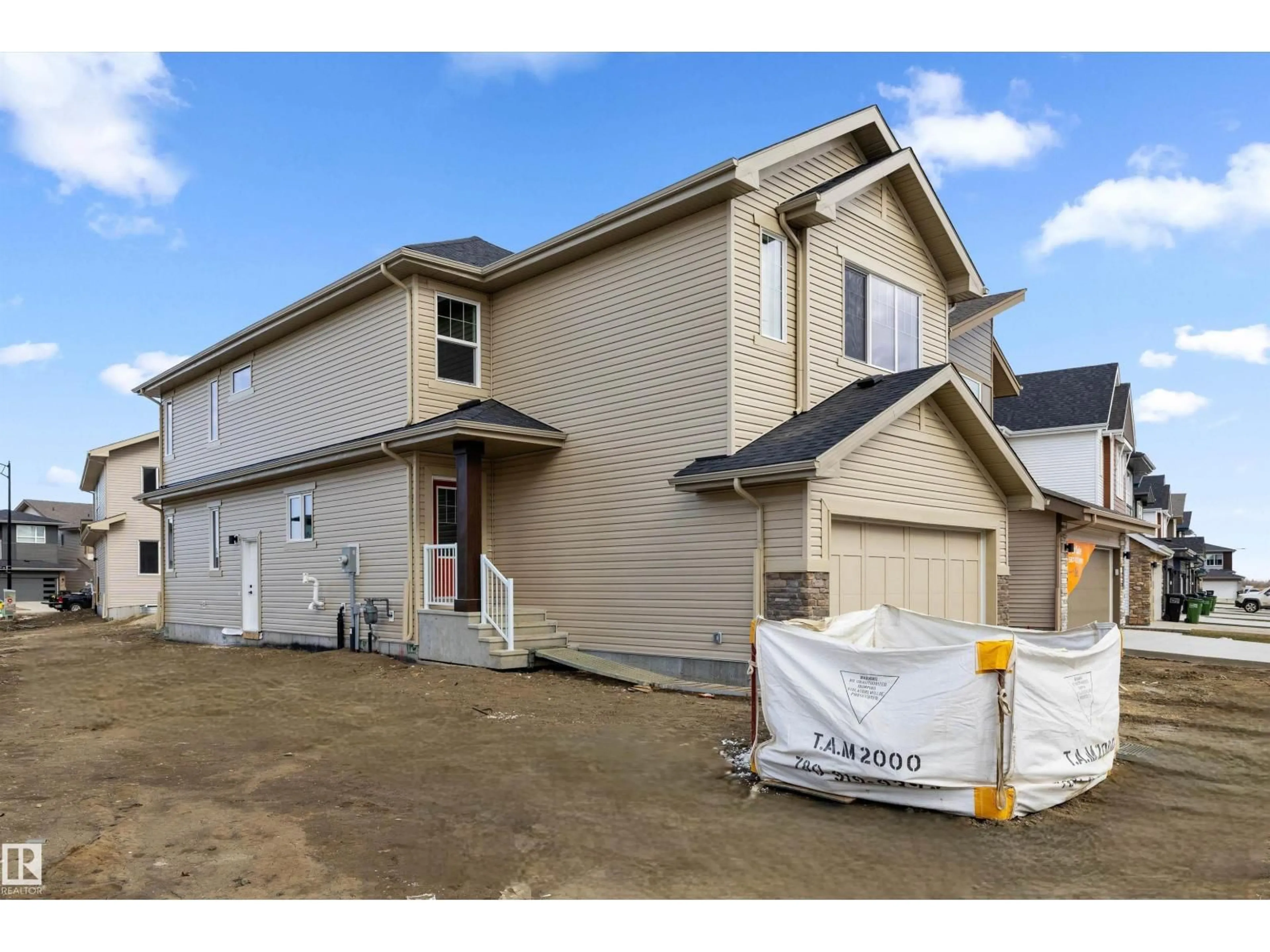 Home with vinyl exterior material, street for NW - 2263 194 ST, Edmonton Alberta T6M3B7