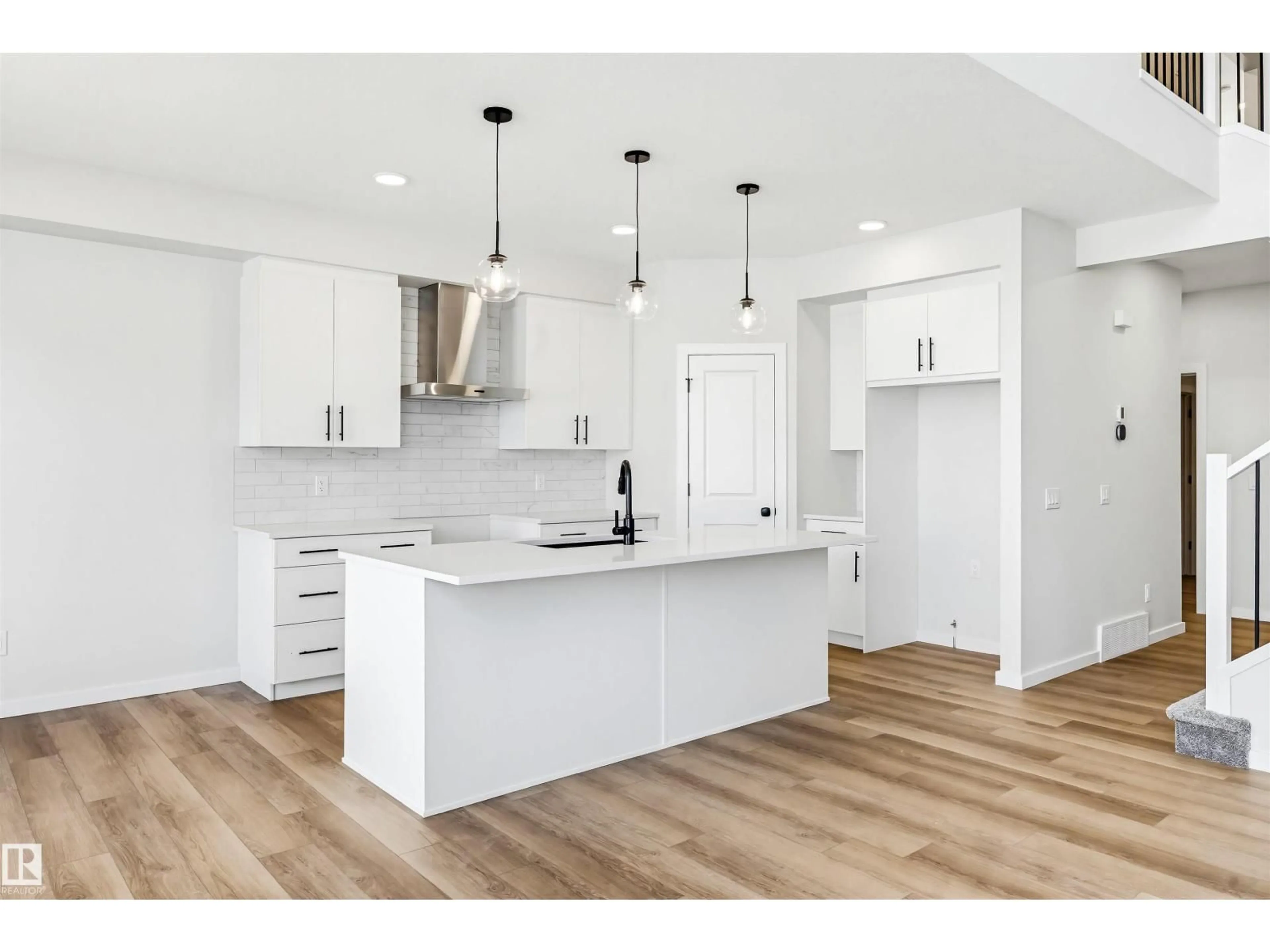 Open concept kitchen, wood/laminate floor for 22812 82 AV, Edmonton Alberta T5T7X9