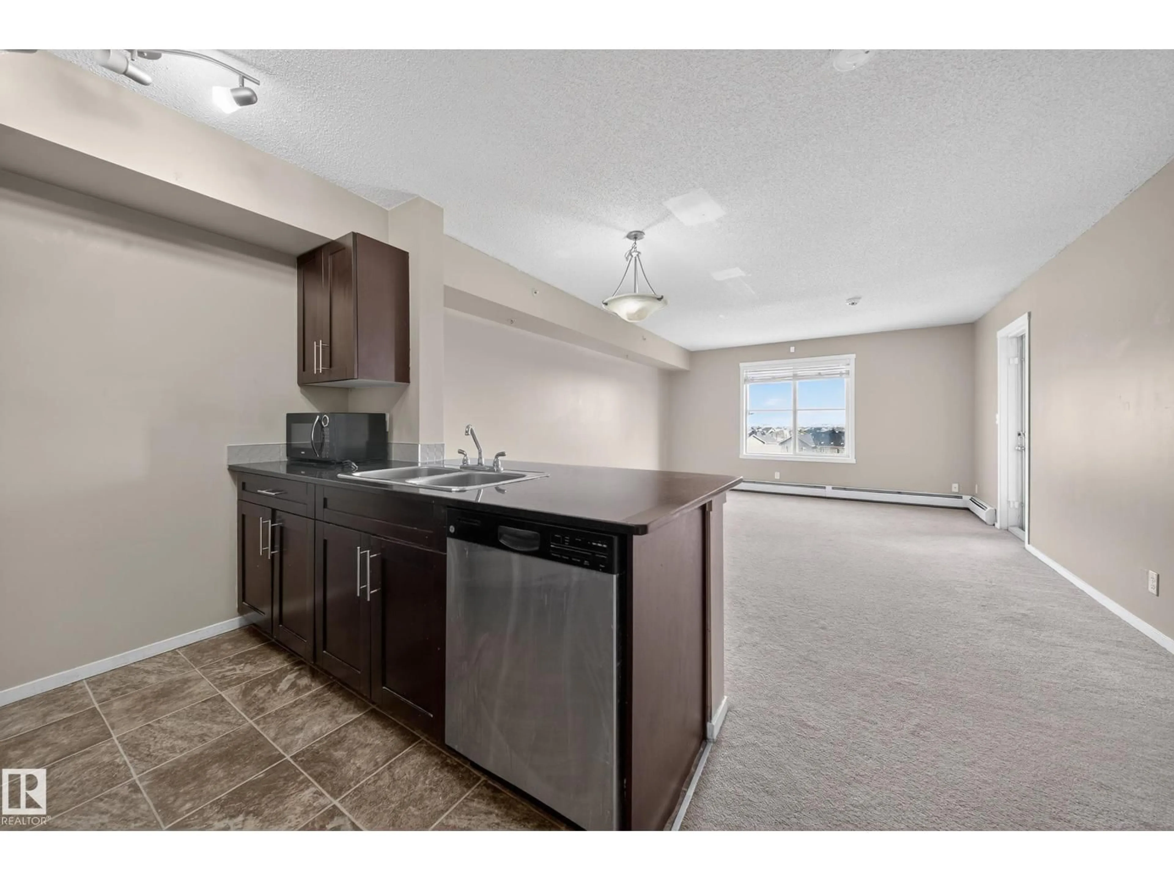 Open concept kitchen, unknown for #412 - 3315 JAMES MOWATT TRAIL, Edmonton Alberta T6W3L9