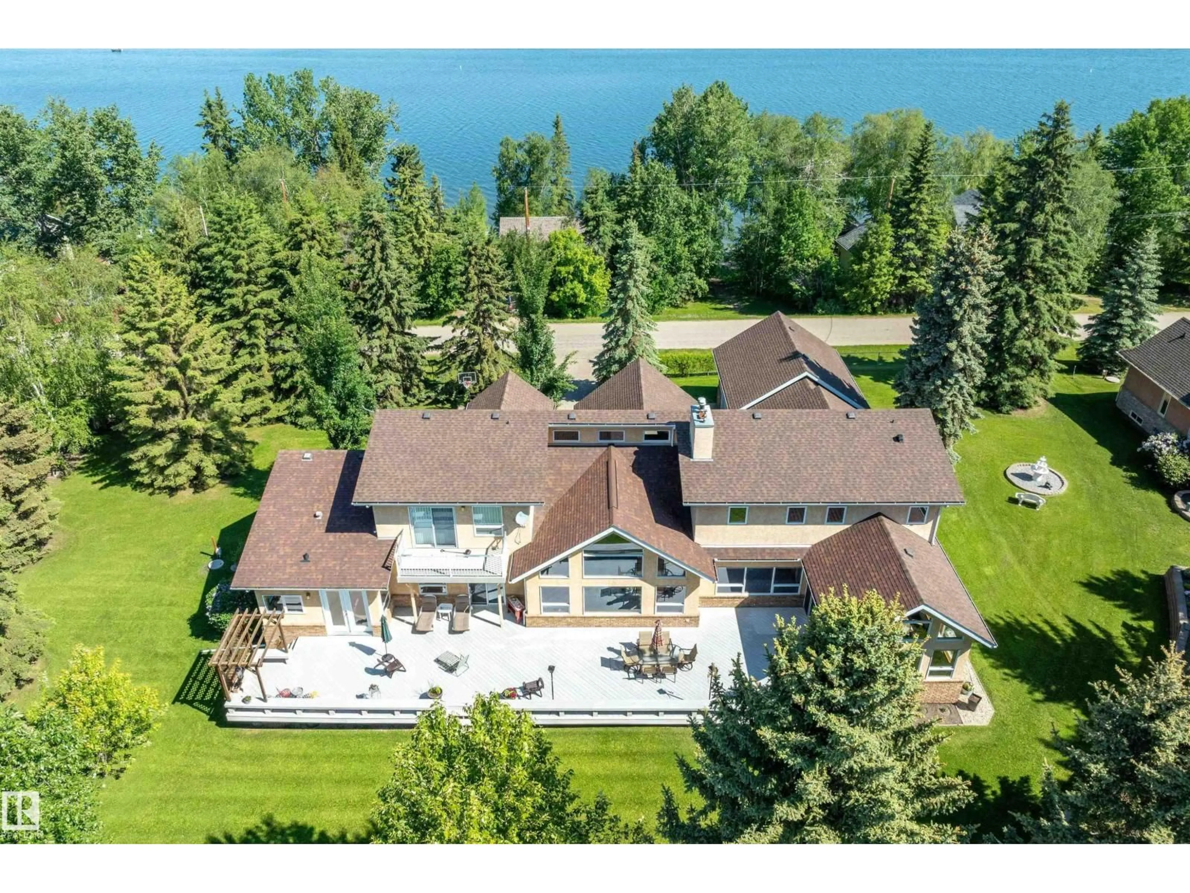 A pic from outside/outdoor area/front of a property/back of a property/a pic from drone, water/lake/river/ocean view for 248 LAKESHORE DR, Rural Wetaskiwin County Alberta T0C2V0