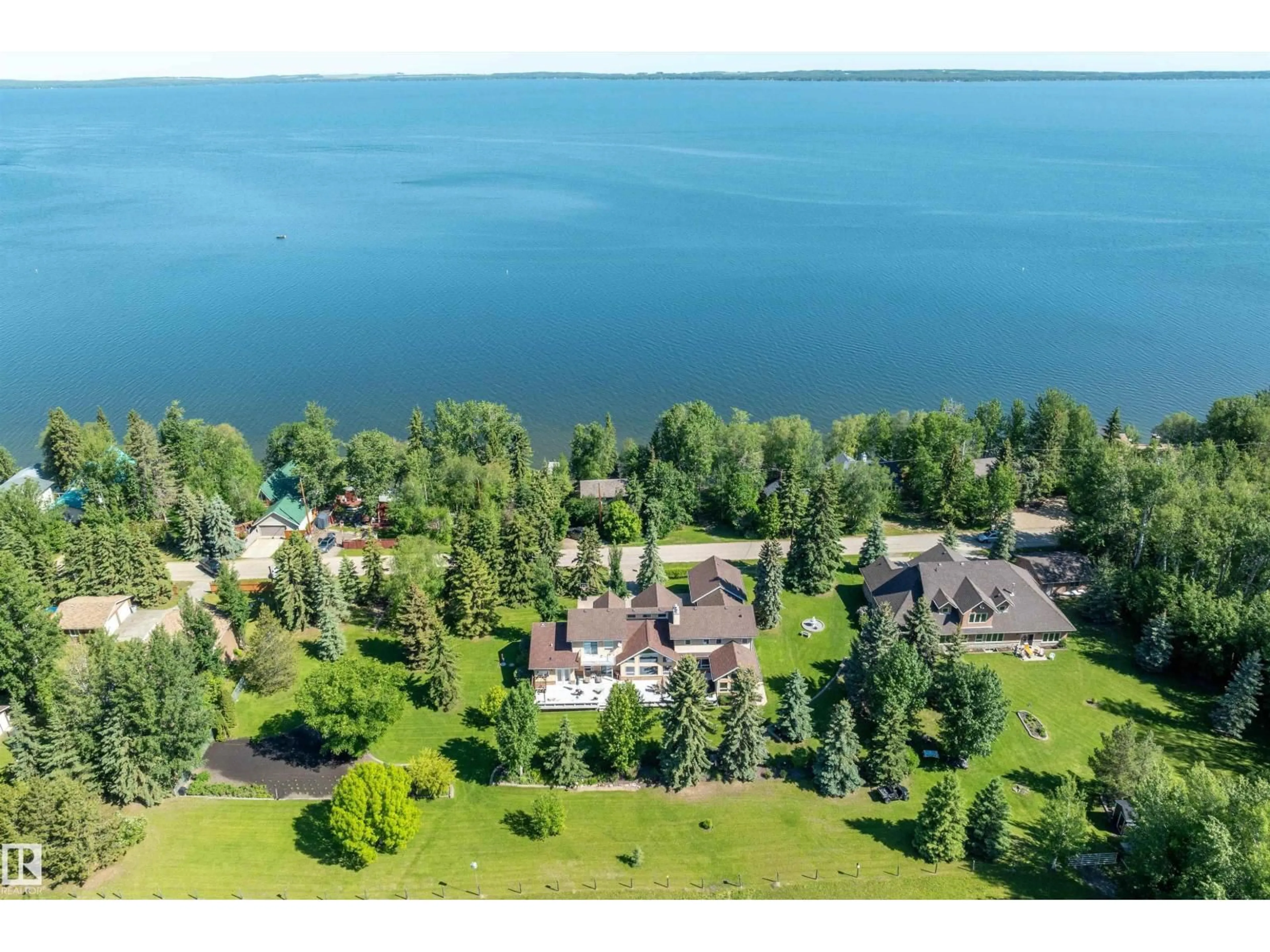 A pic from outside/outdoor area/front of a property/back of a property/a pic from drone, water/lake/river/ocean view for 248 LAKESHORE DR, Rural Wetaskiwin County Alberta T0C2V0