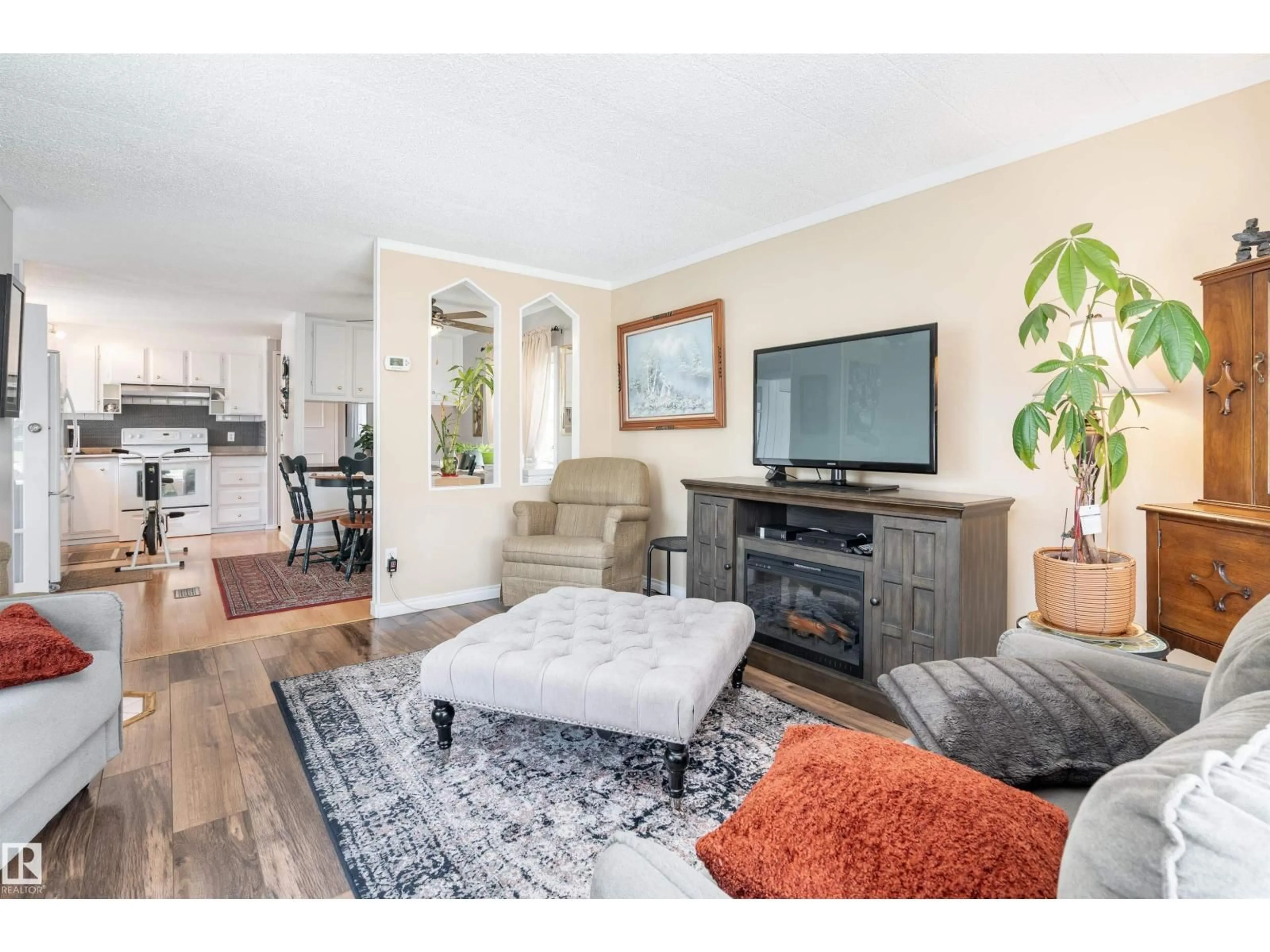 Living room with furniture, wood/laminate floor for NW - 2438 LAKEVIEW BA, Edmonton Alberta T5S1T7