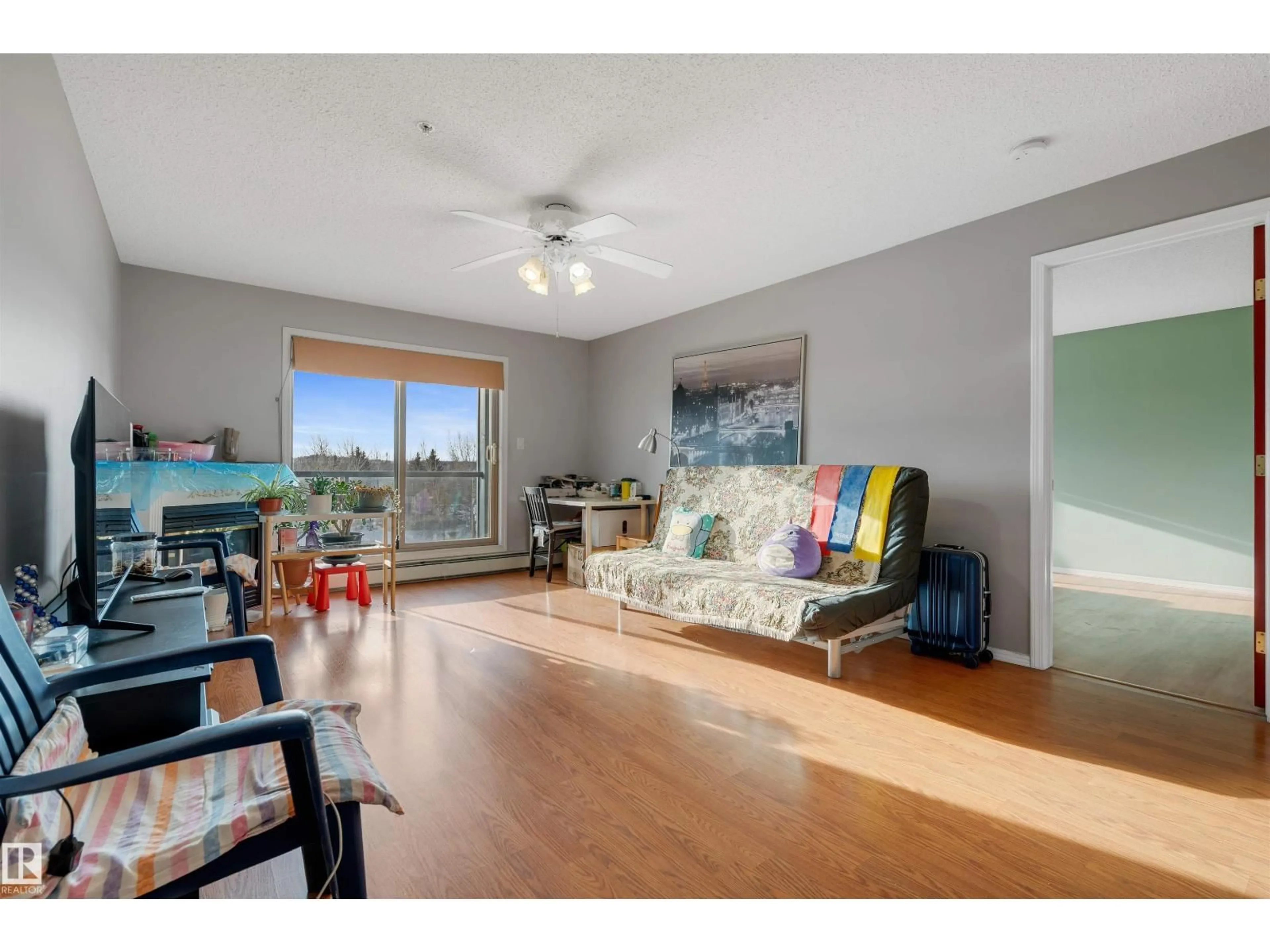 Living room with furniture, wood/laminate floor for #329 - 2903 RABBIT HILL RD, Edmonton Alberta T6R3A3