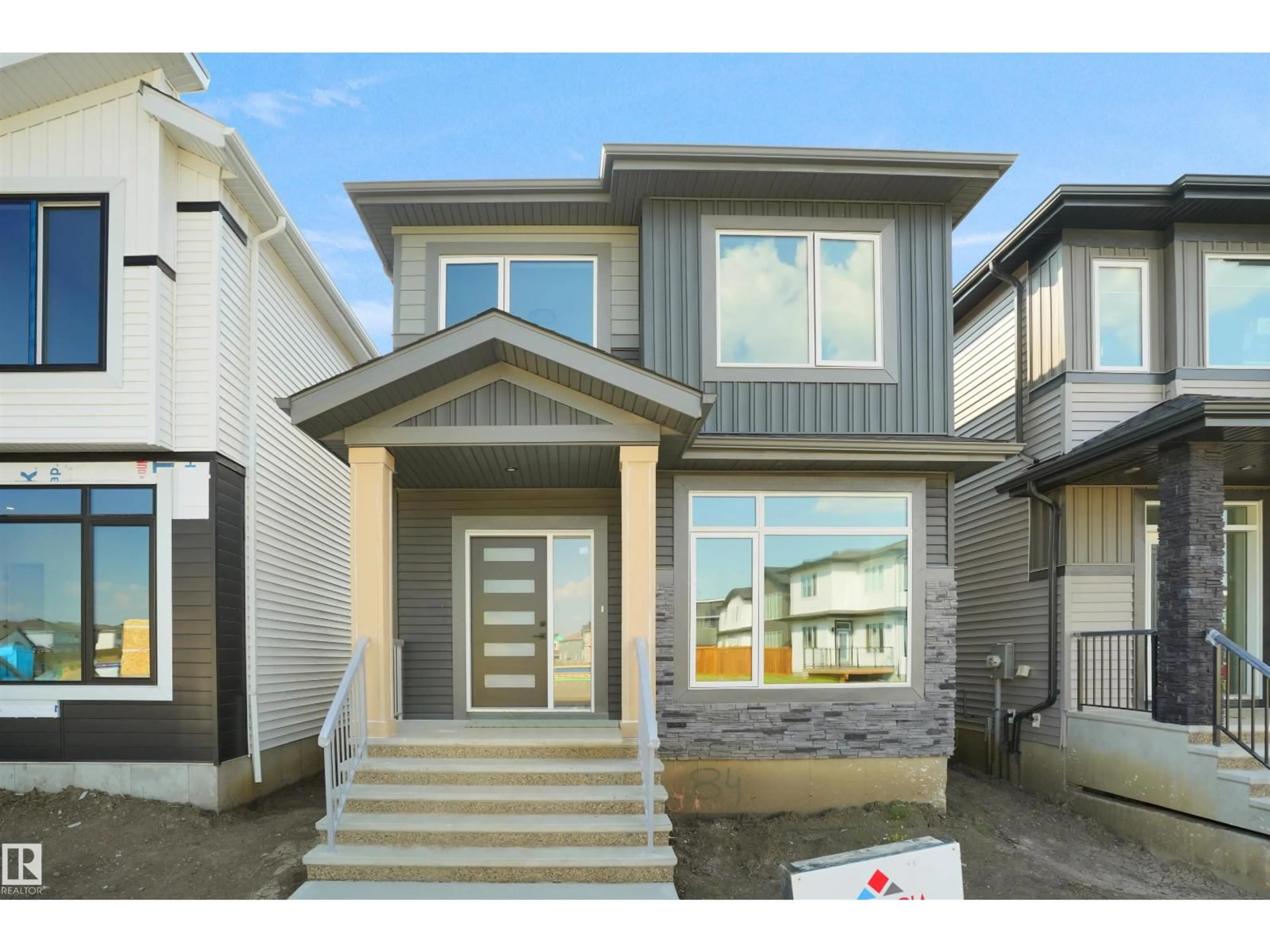 Home with vinyl exterior material, street for 84 BLACKBIRD BN, Fort Saskatchewan Alberta T8L1X5