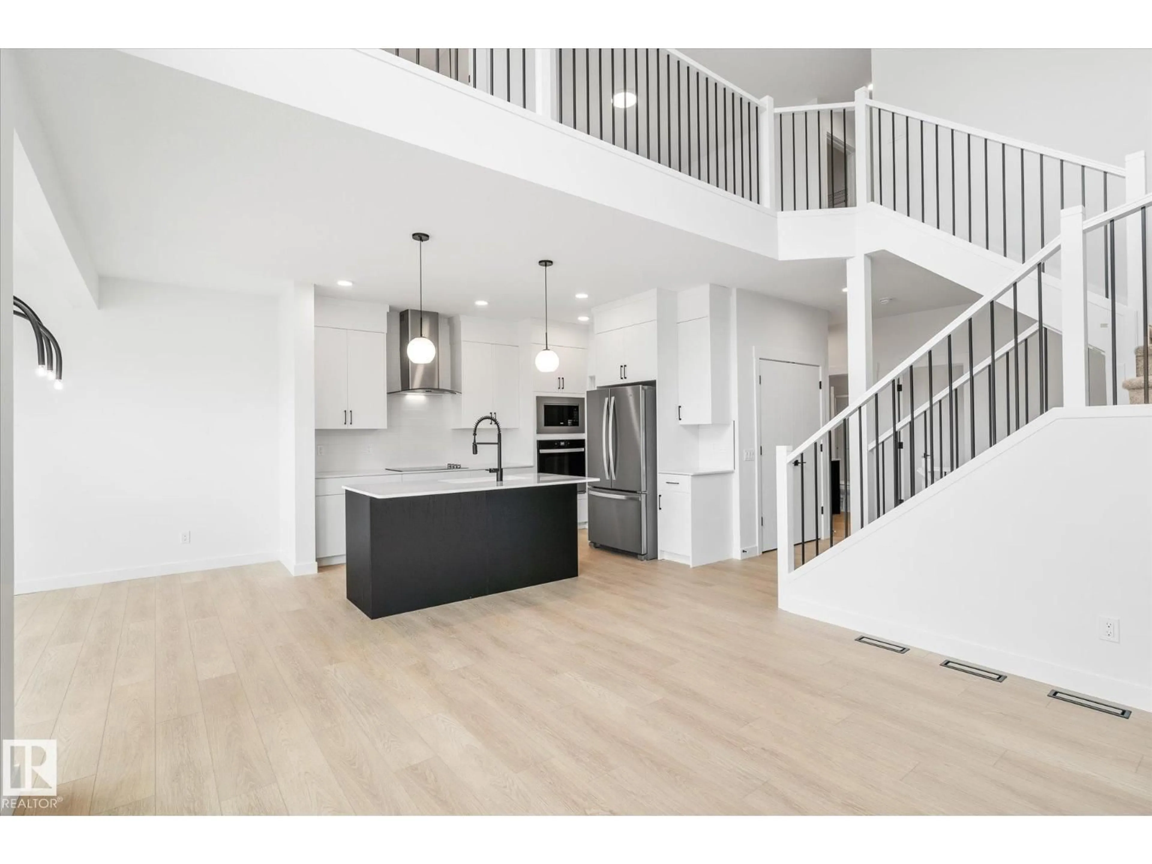 Open concept kitchen, wood/laminate floor for NW - 22607 89 AV, Edmonton Alberta T5T7W8