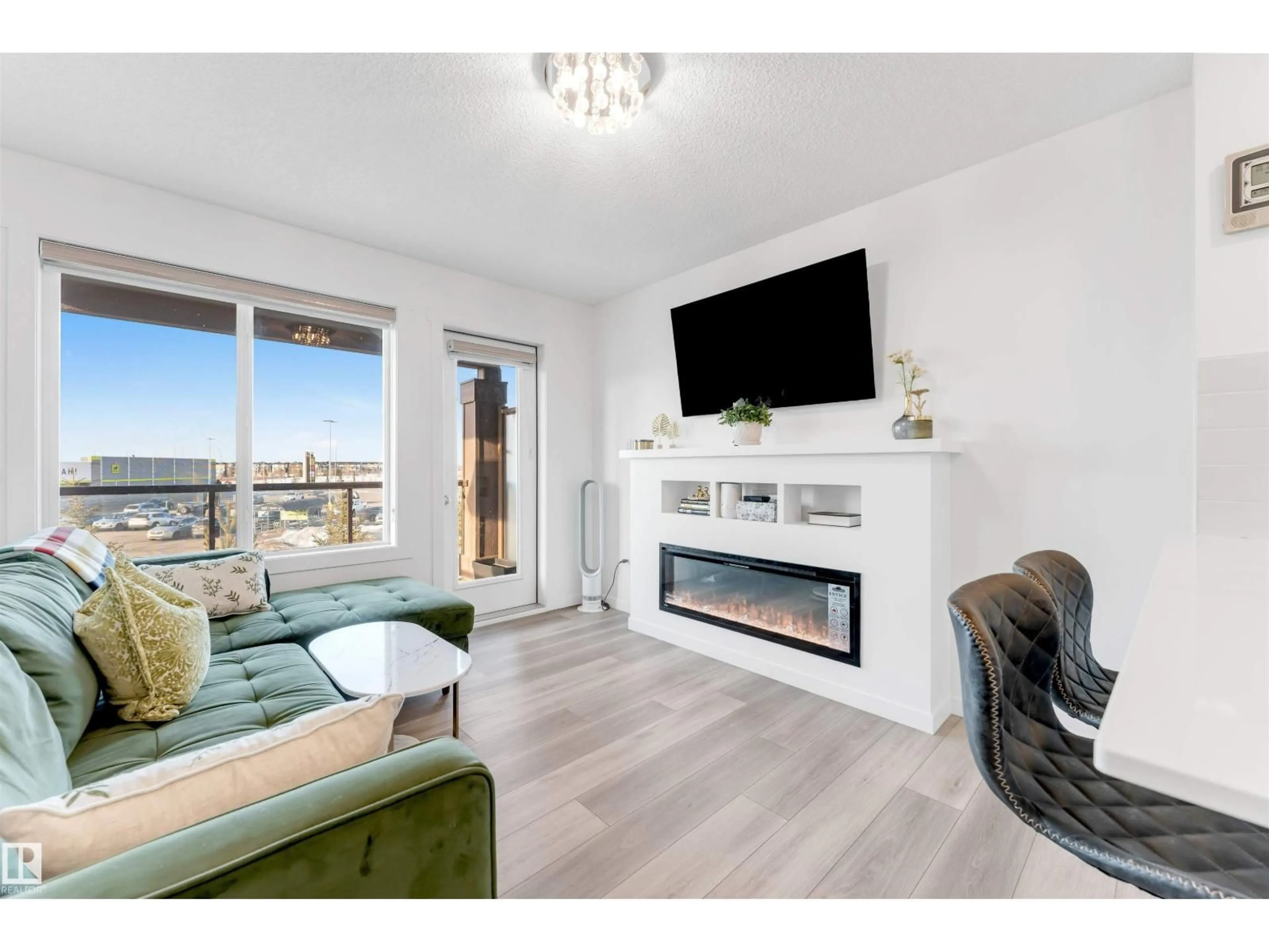 Living room with furniture, wood/laminate floor for #56 - 1530 TAMARACK BV, Edmonton Alberta T6T2E6