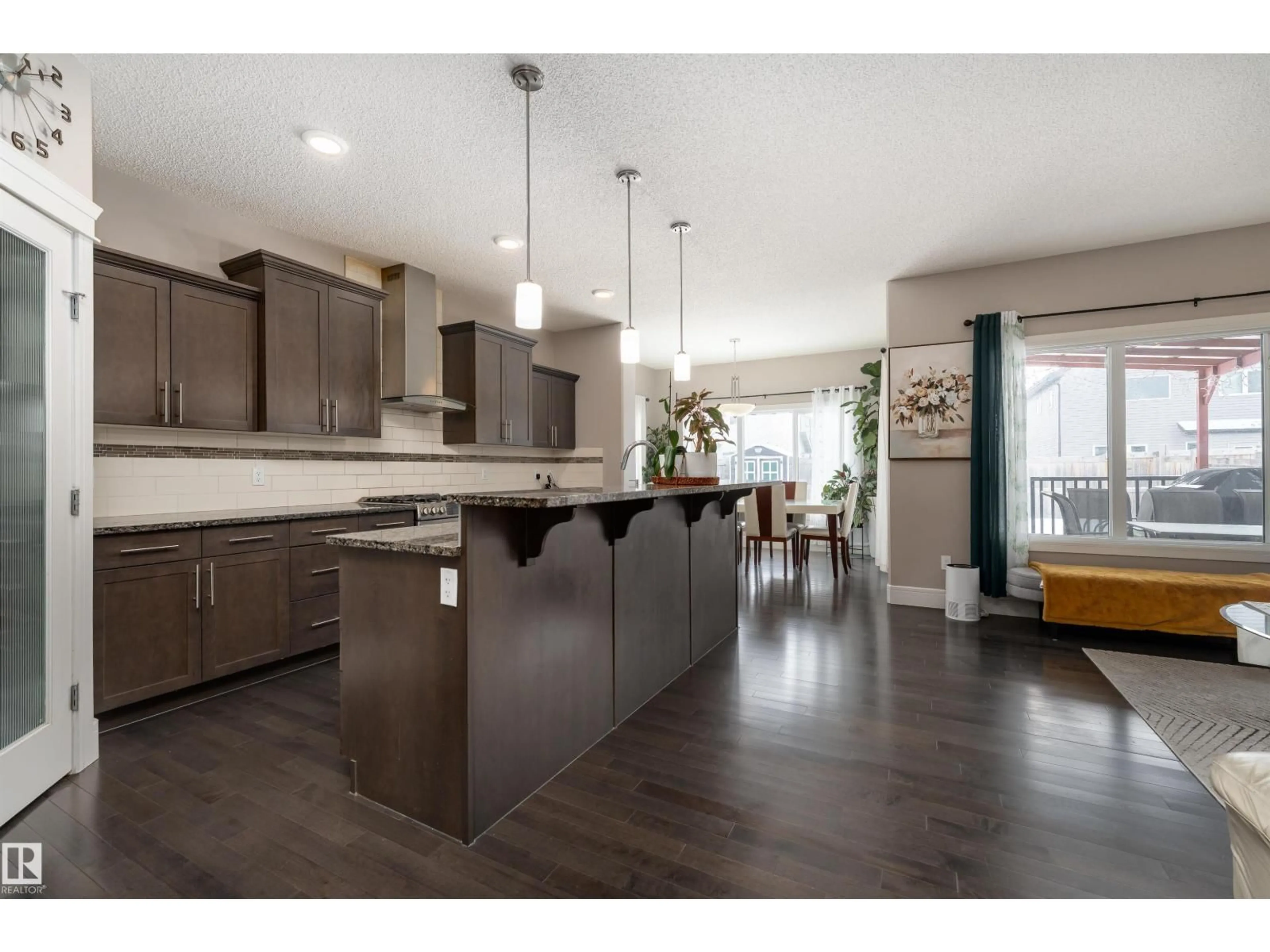 Open concept kitchen, wood/laminate floor for 12019 173 AV, Edmonton Alberta T5X0J6