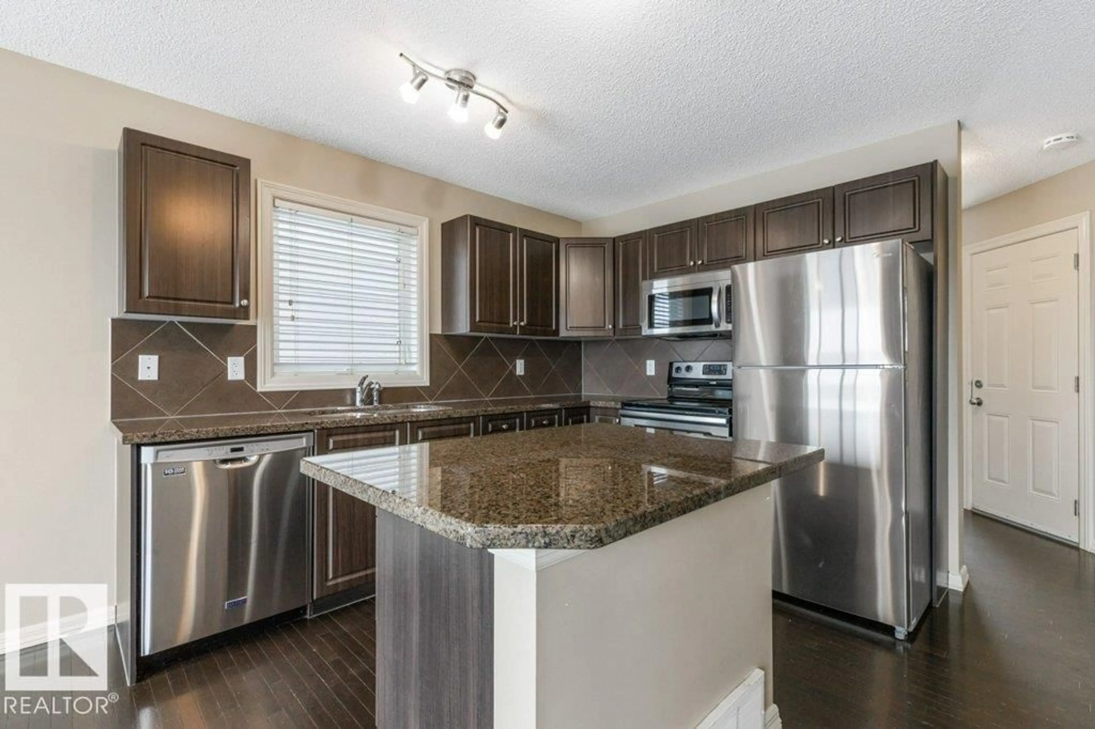 Open concept kitchen, unknown for 130 KEYSTONE CR, Leduc Alberta T9E0M6