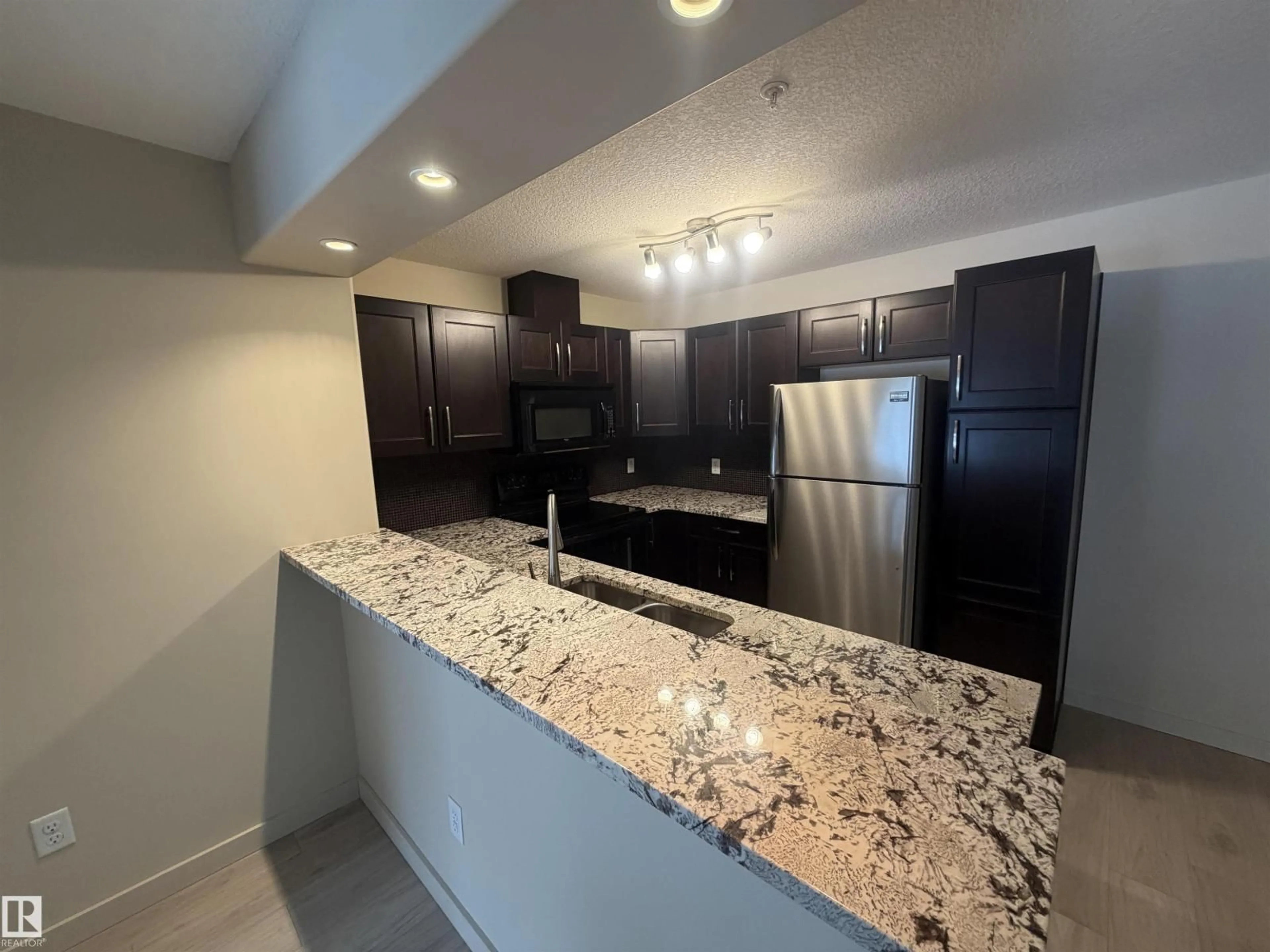 Open concept kitchen, ceramic/tile floor for #145 - 11505 ELLERSLIE RD, Edmonton Alberta T6W2A9