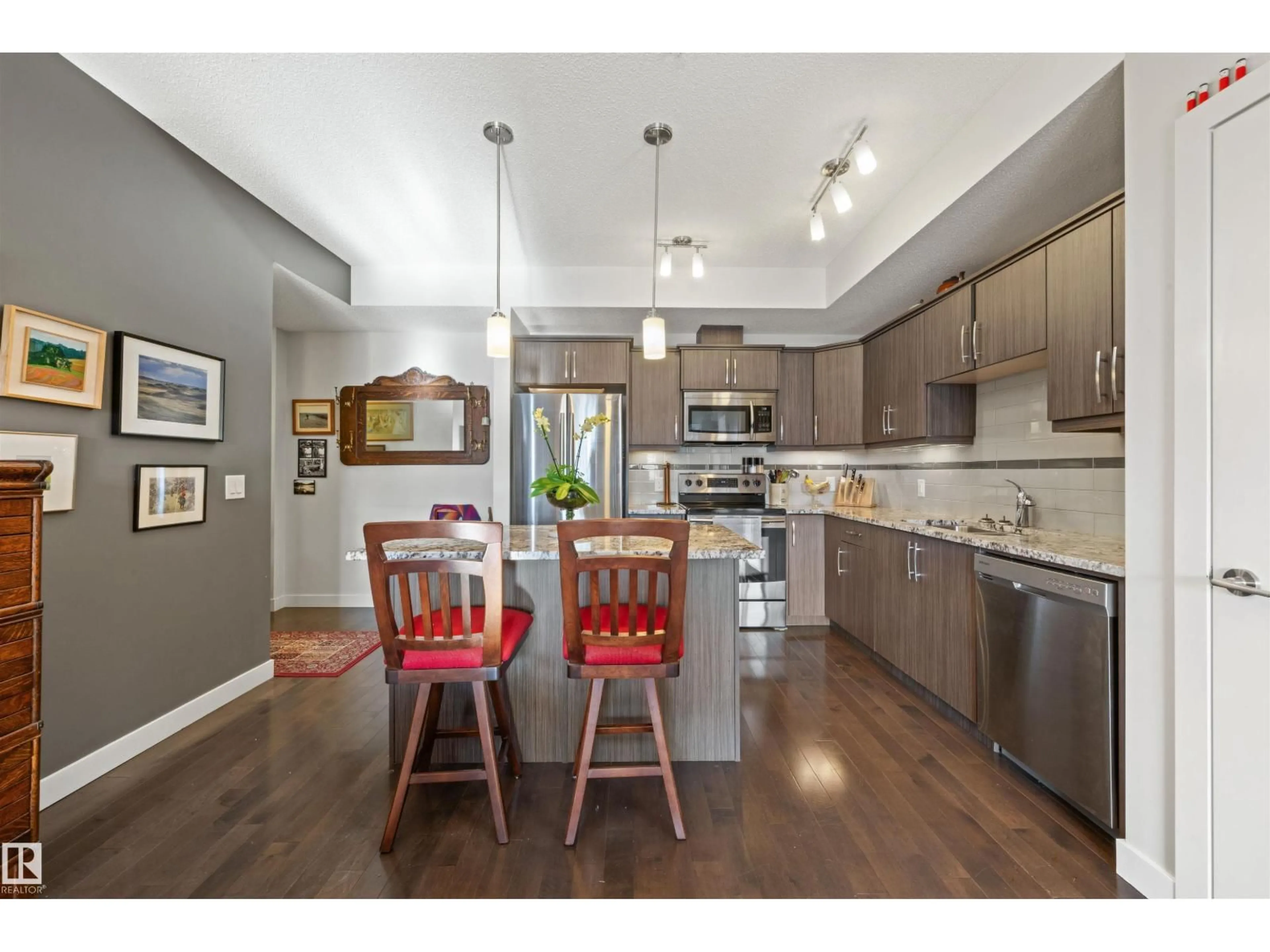 Open concept kitchen, wood/laminate floor for #402 - 10523 123 ST, Edmonton Alberta T5N1N9