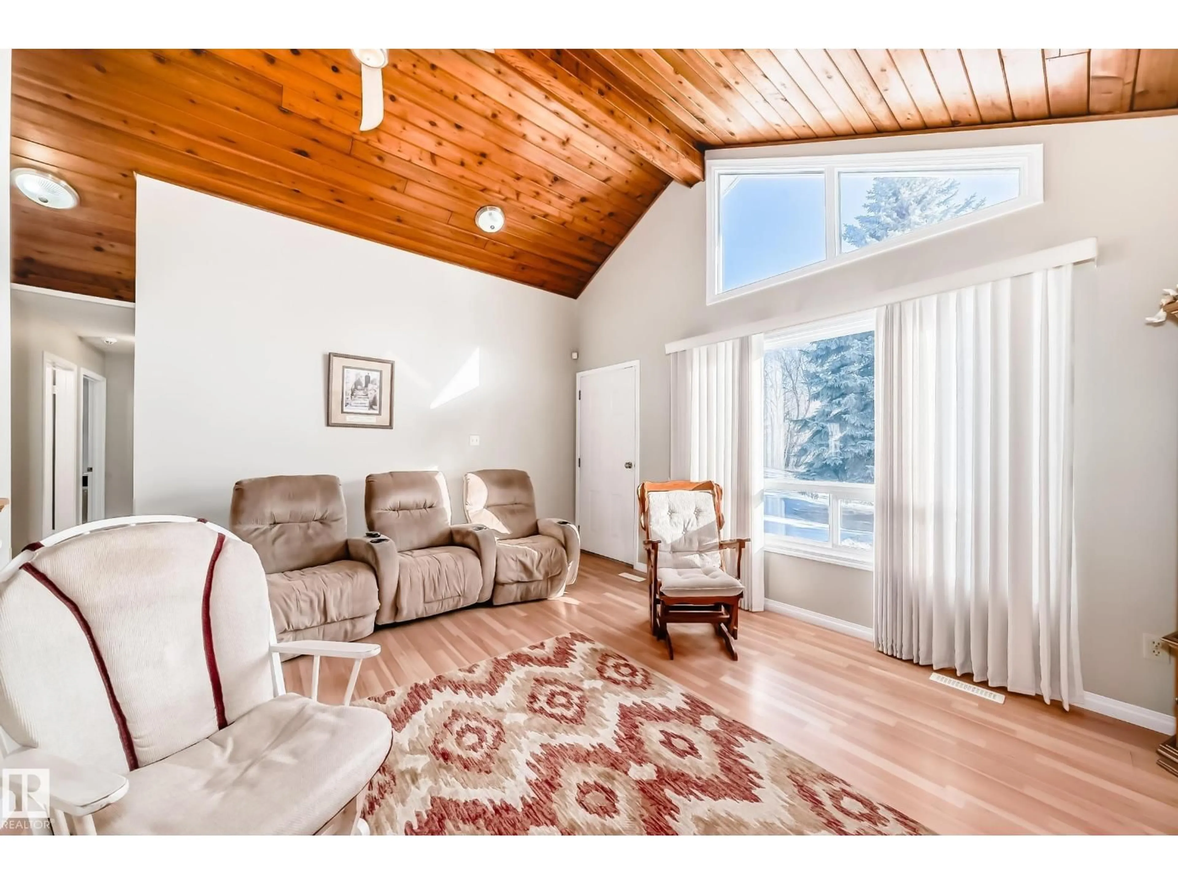 Living room with furniture, wood/laminate floor for #6 - 1511 PARKLAND DR, Rural Parkland County Alberta T7Y2T6