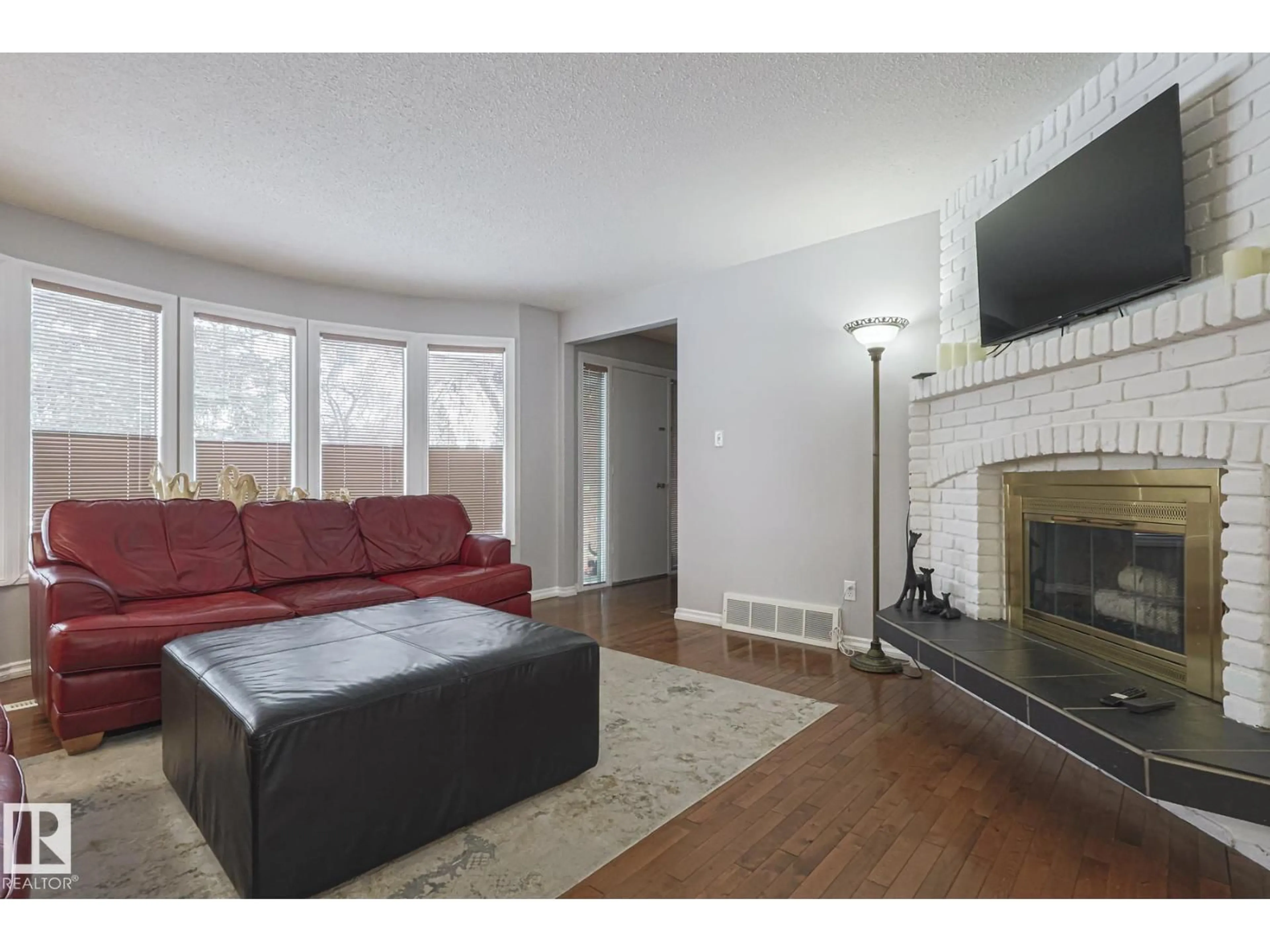 Living room with furniture, wood/laminate floor for 213 GROVELAND PL, Sherwood Park Alberta T8A3G3