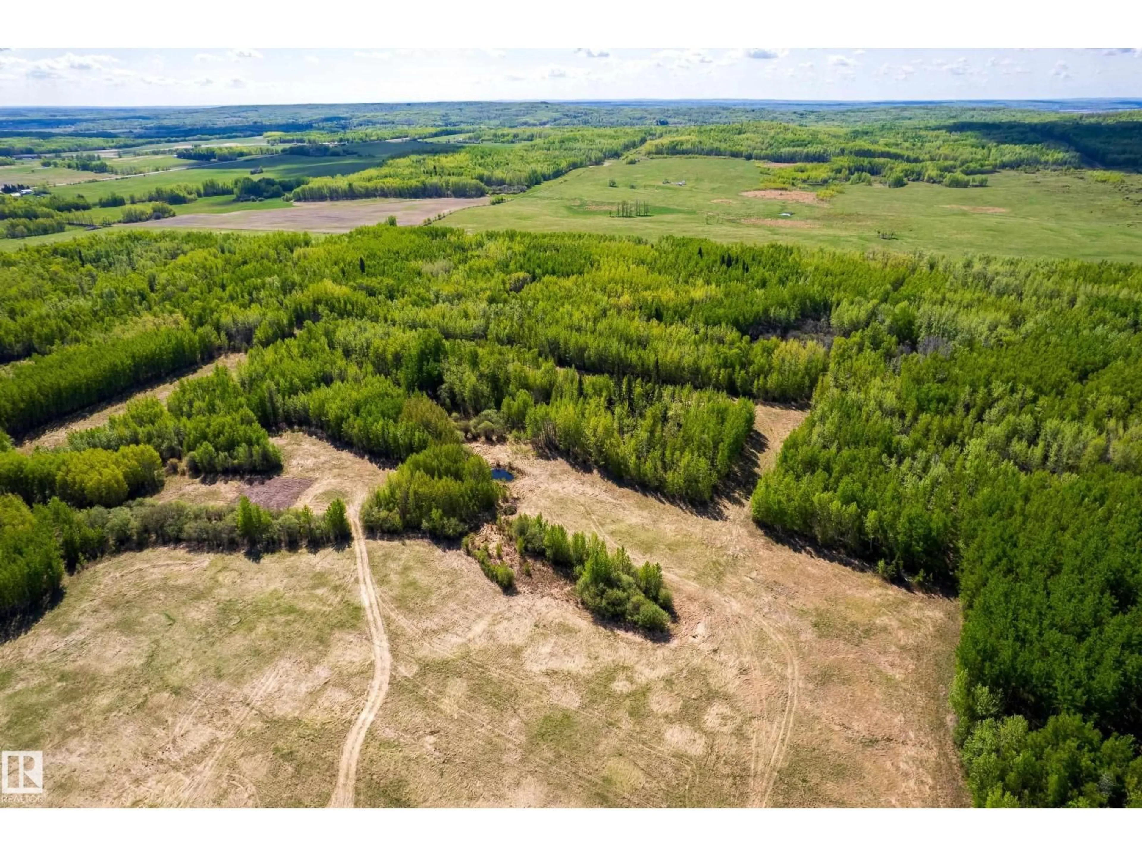 A pic from outside/outdoor area/front of a property/back of a property/a pic from drone, forest/trees view for 6521 TWP RD 554, Rural Lac Ste. Anne County Alberta T0E2A0