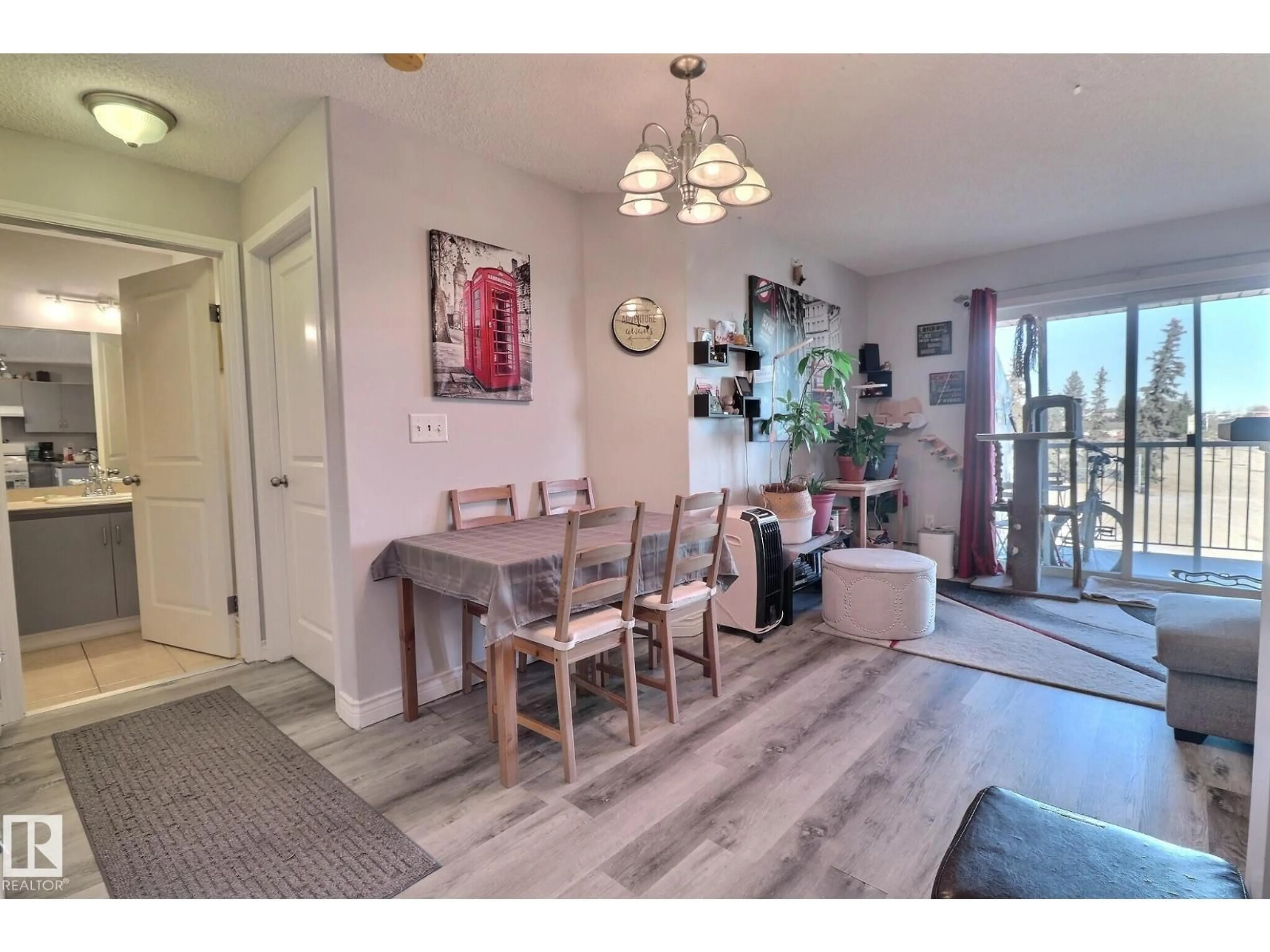 Dining room, wood/laminate floor for #416 - 14708 50 ST, Edmonton Alberta T5A5B7