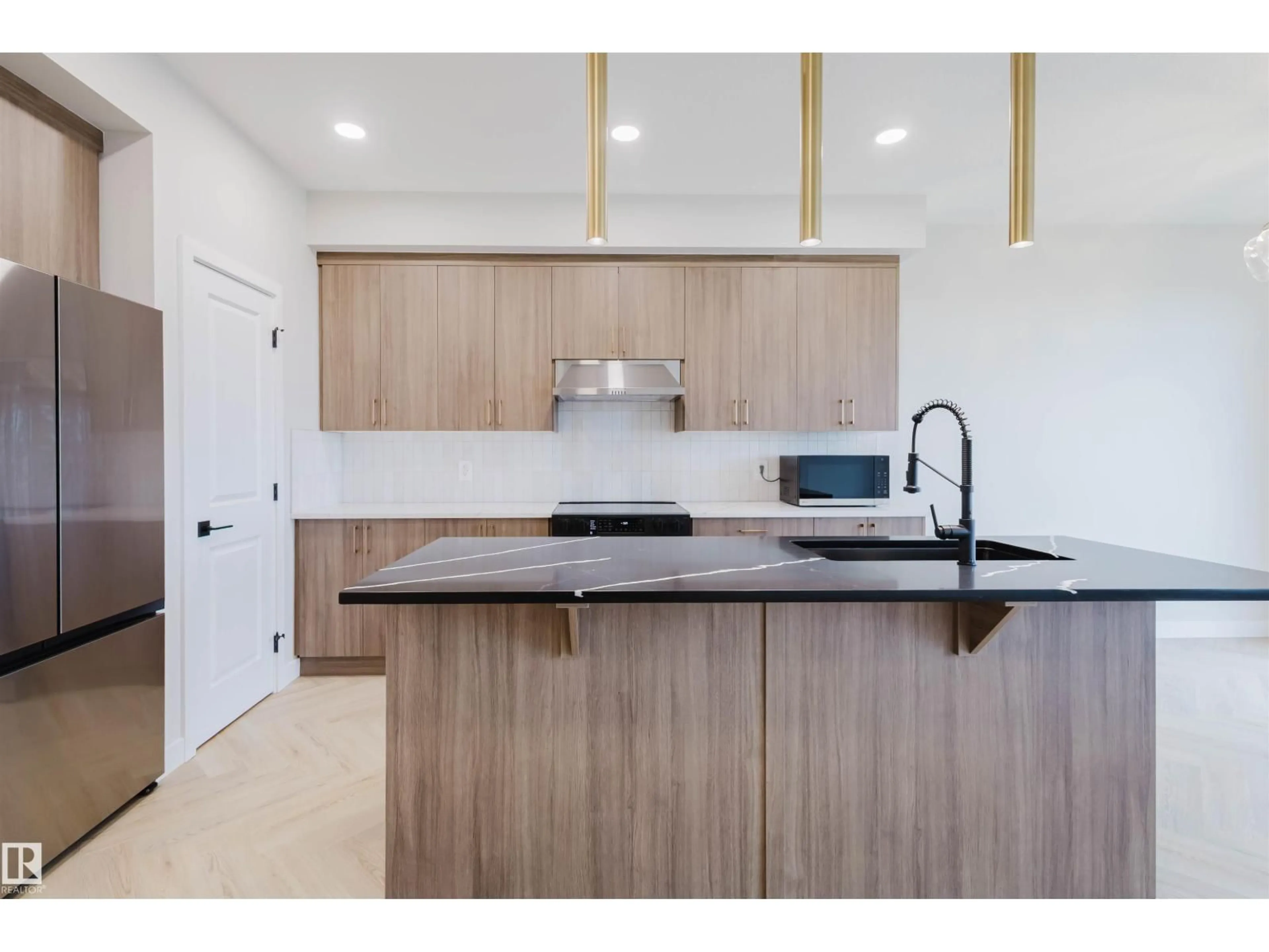 Open concept kitchen, wood/laminate floor for SW - 8292 KIRIAK LO, Edmonton Alberta T6W5S2