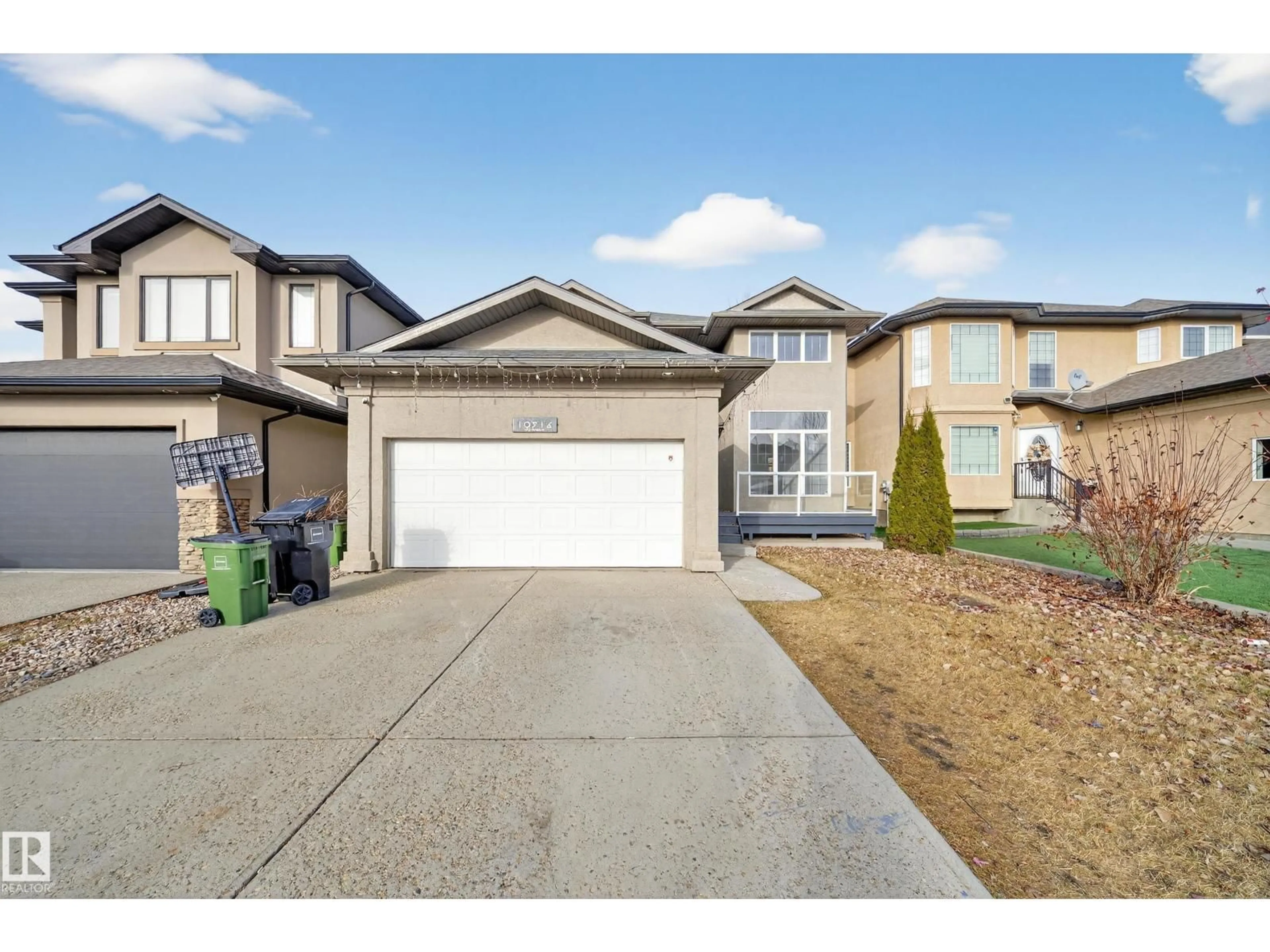 Home with vinyl exterior material, street for NW - 10916 175 AV, Edmonton Alberta T5Y0B7