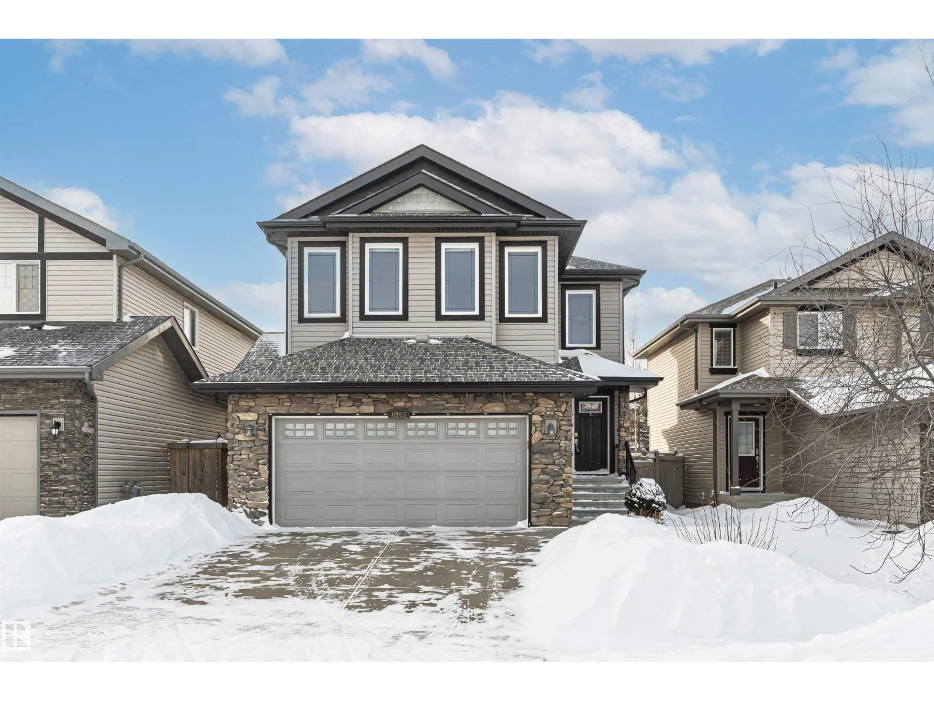 Home with vinyl exterior material, street for 6963 19A AV, Edmonton Alberta T6X0L7