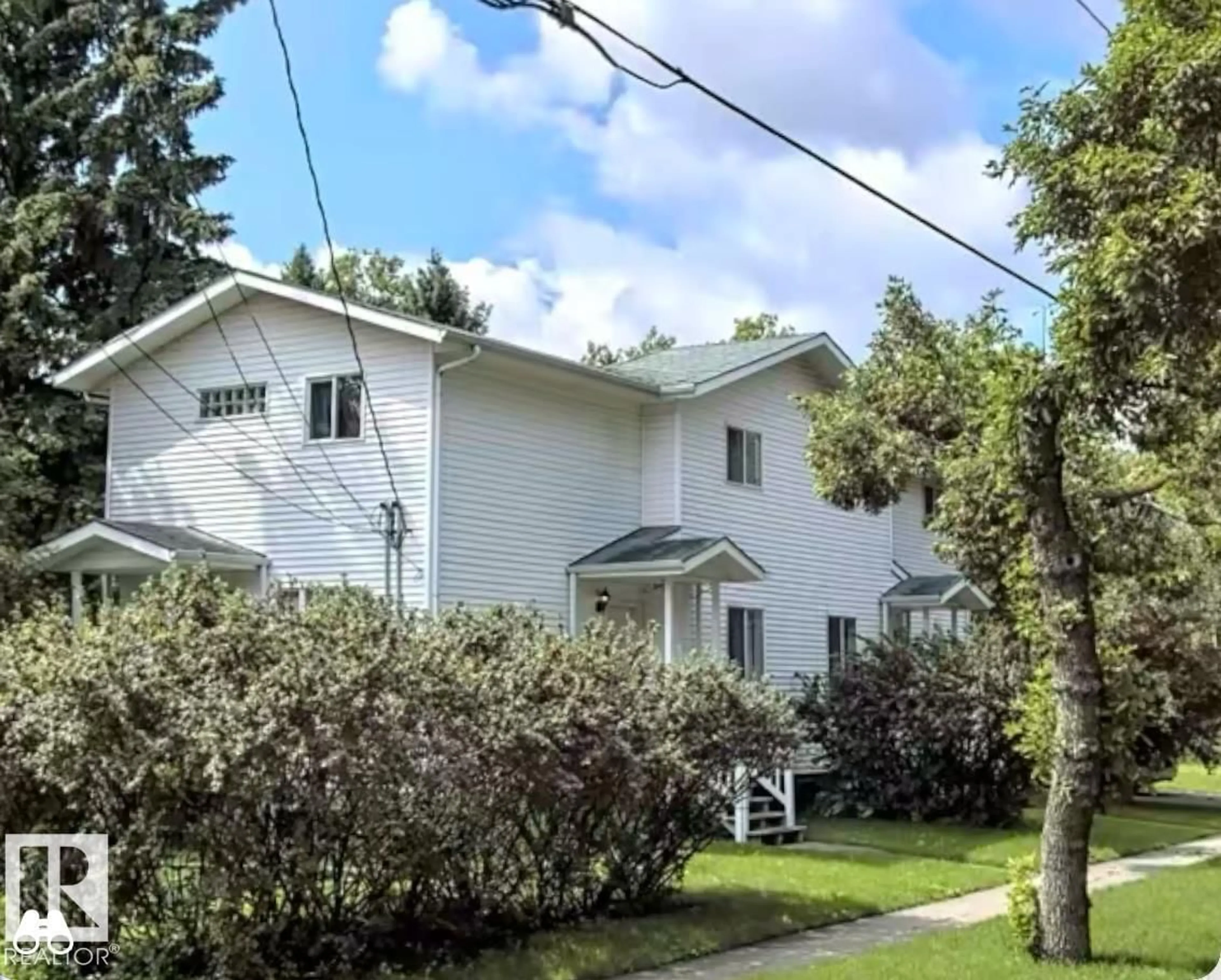 Home with vinyl exterior material, street for 9515B 120 AV, Edmonton Alberta T5G3J1