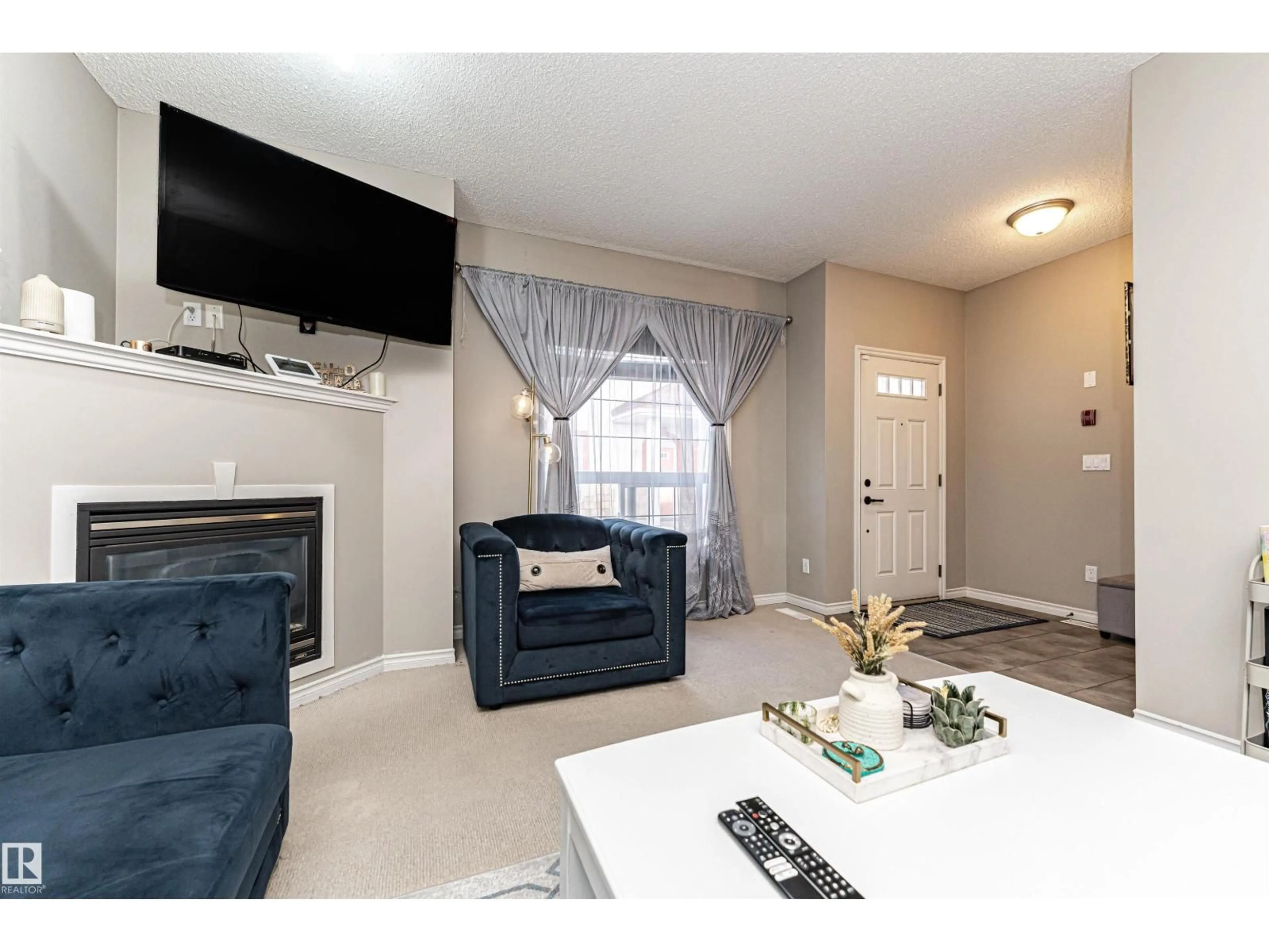 Living room with furniture, unknown for #103 - 13825 155 AV, Edmonton Alberta T6V0B8