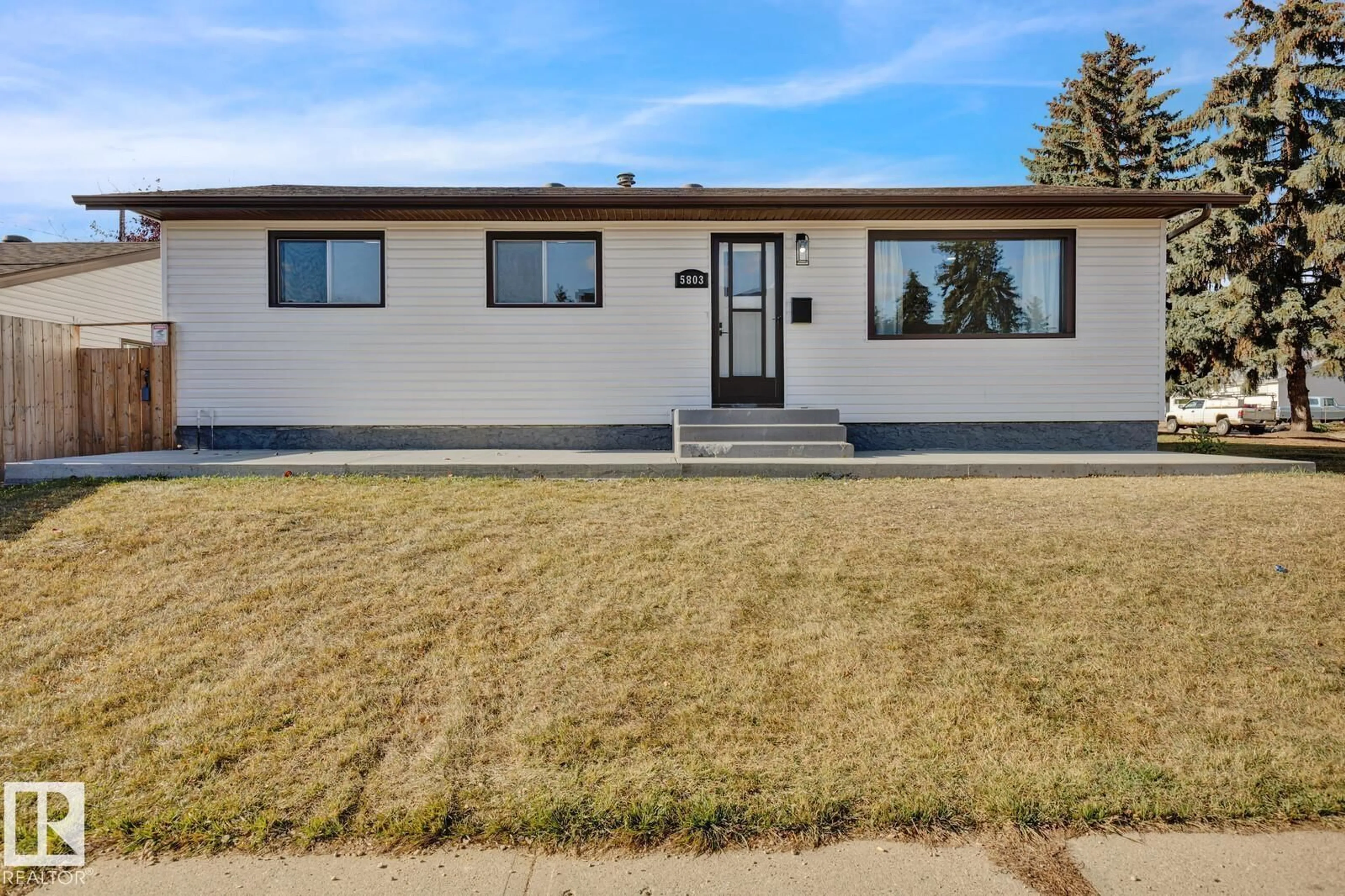 Home with vinyl exterior material, street for 5803 136 AV NW, Edmonton Alberta T5A0N4