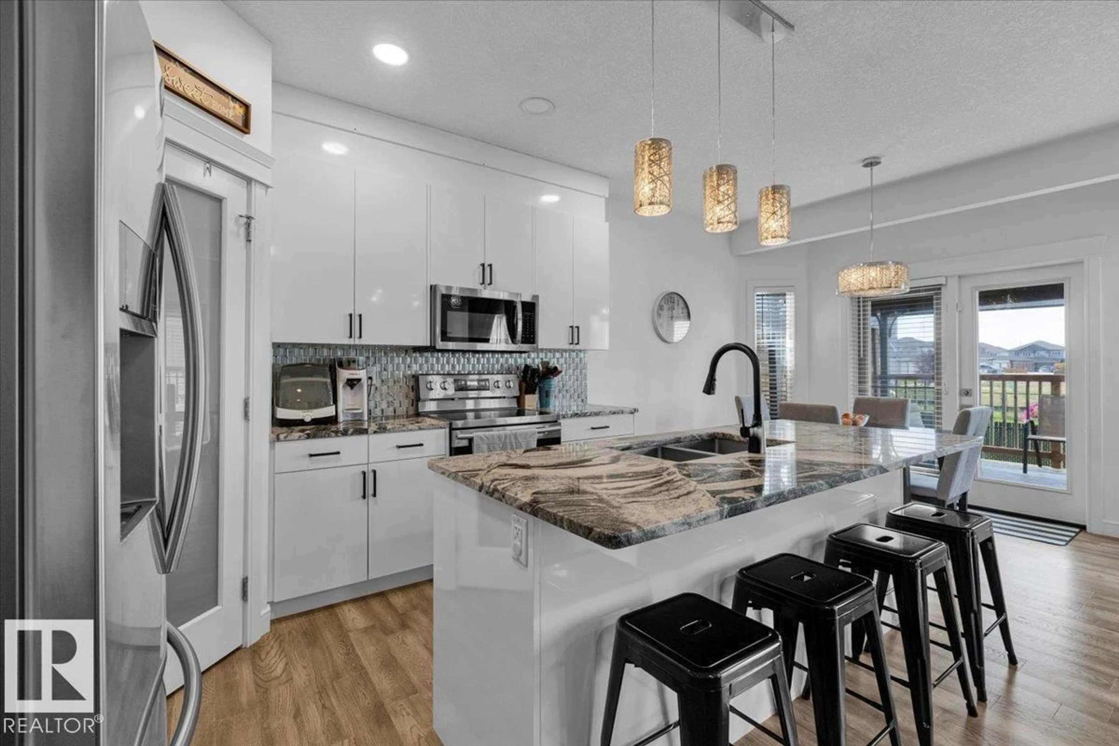 Open concept kitchen, ceramic/tile floor for 10706 97 ST, Morinville Alberta T8R0E9