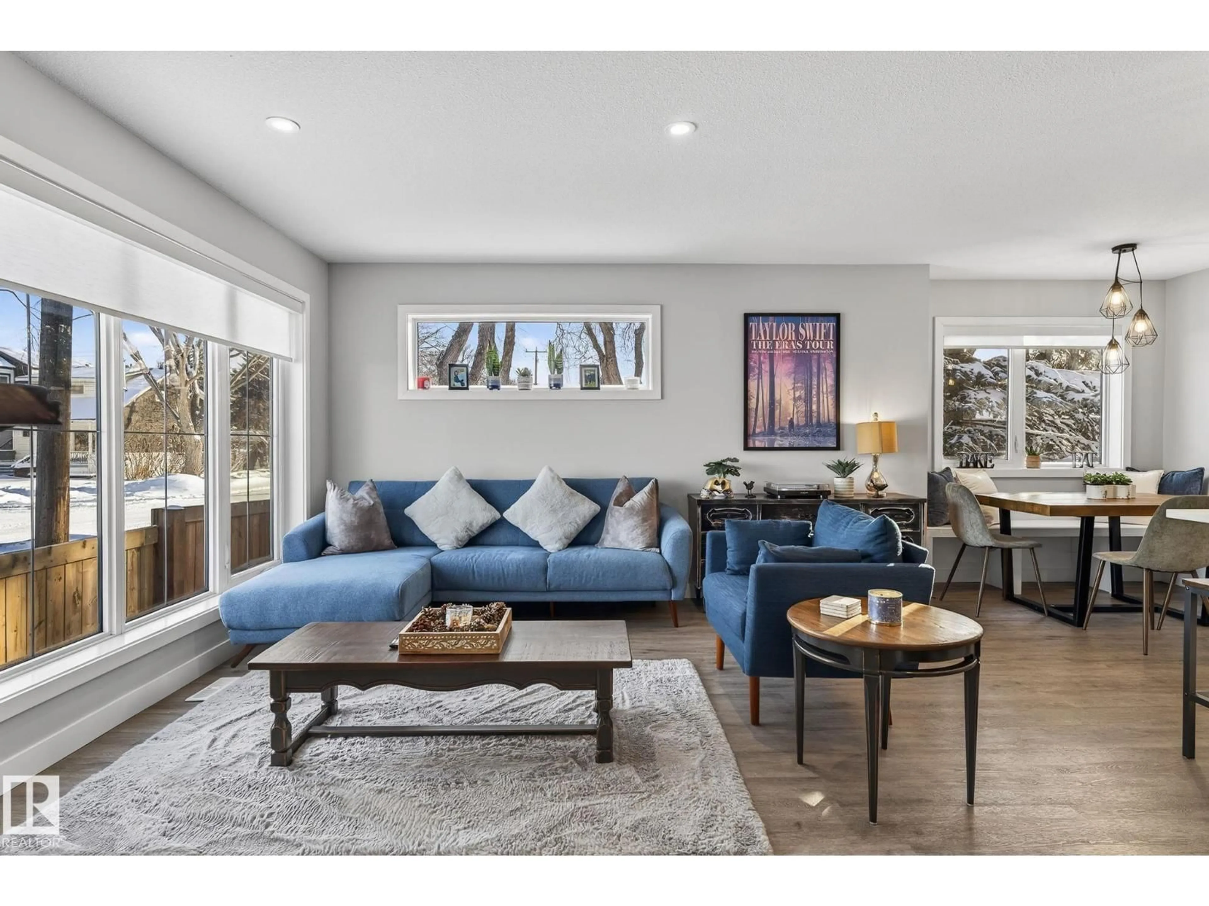 Living room with furniture, wood/laminate floor for NW - 9103 120 AV, Edmonton Alberta T5B4B6