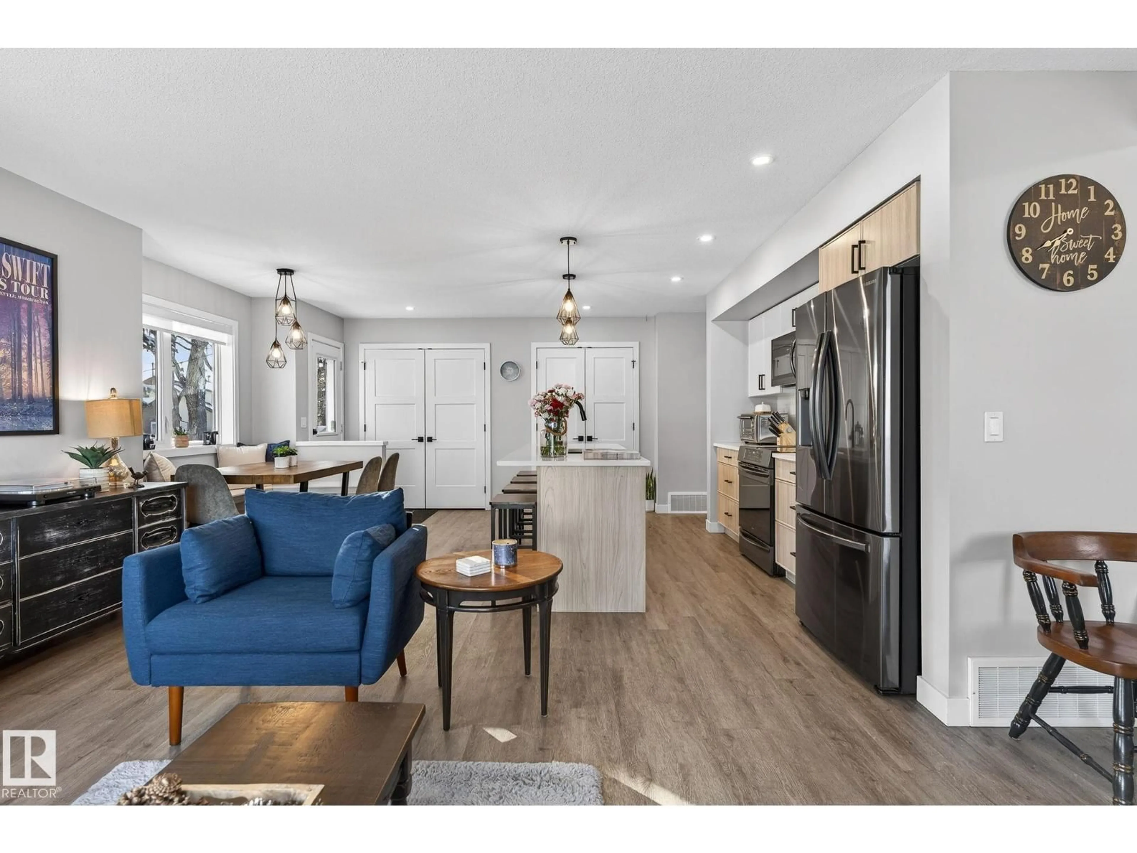 Open concept kitchen, wood/laminate floor for NW - 9103 120 AV, Edmonton Alberta T5B4B6