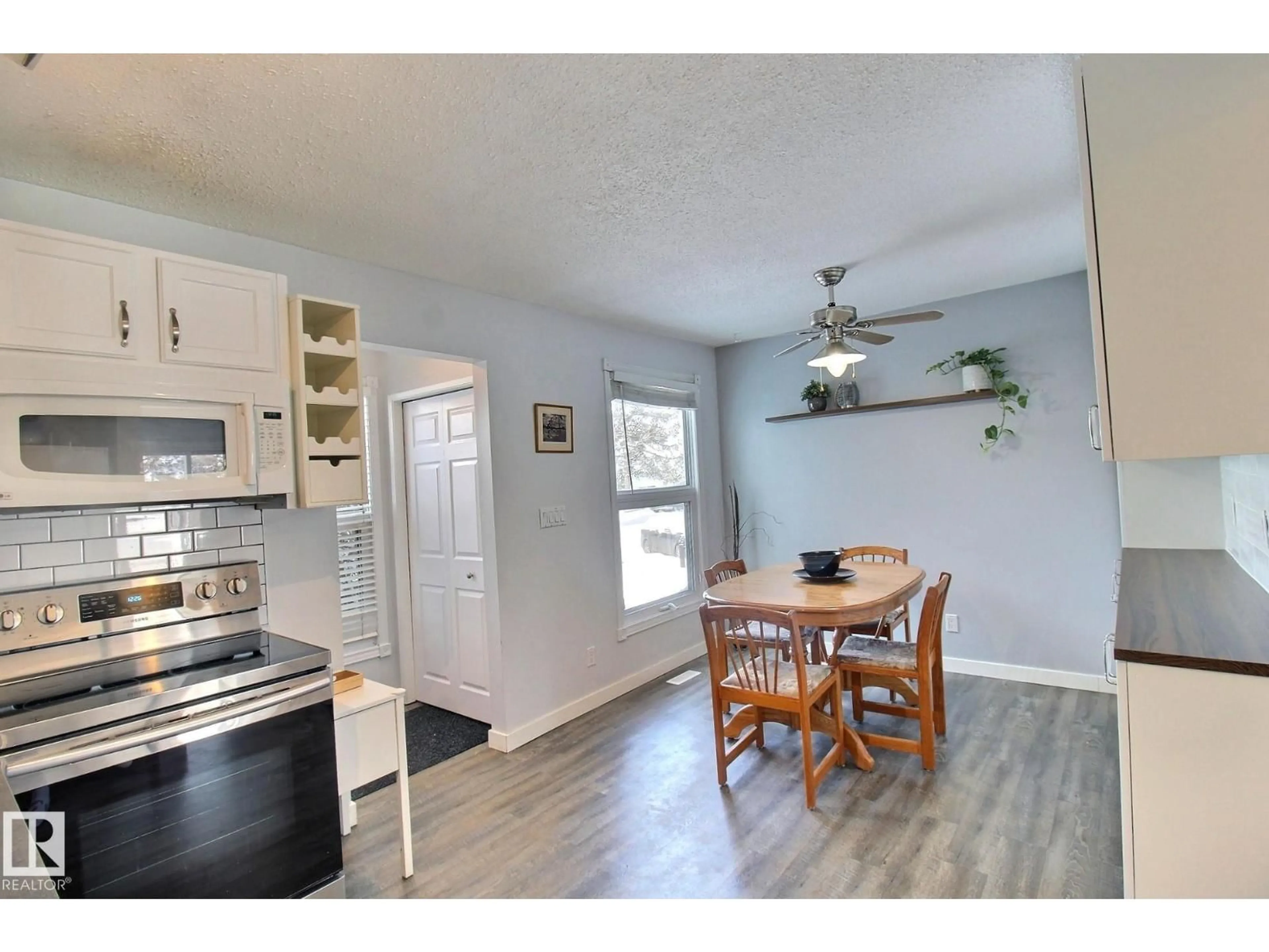 Open concept kitchen, wood/laminate floor for 10410 28A AV, Edmonton Alberta T6J4J3
