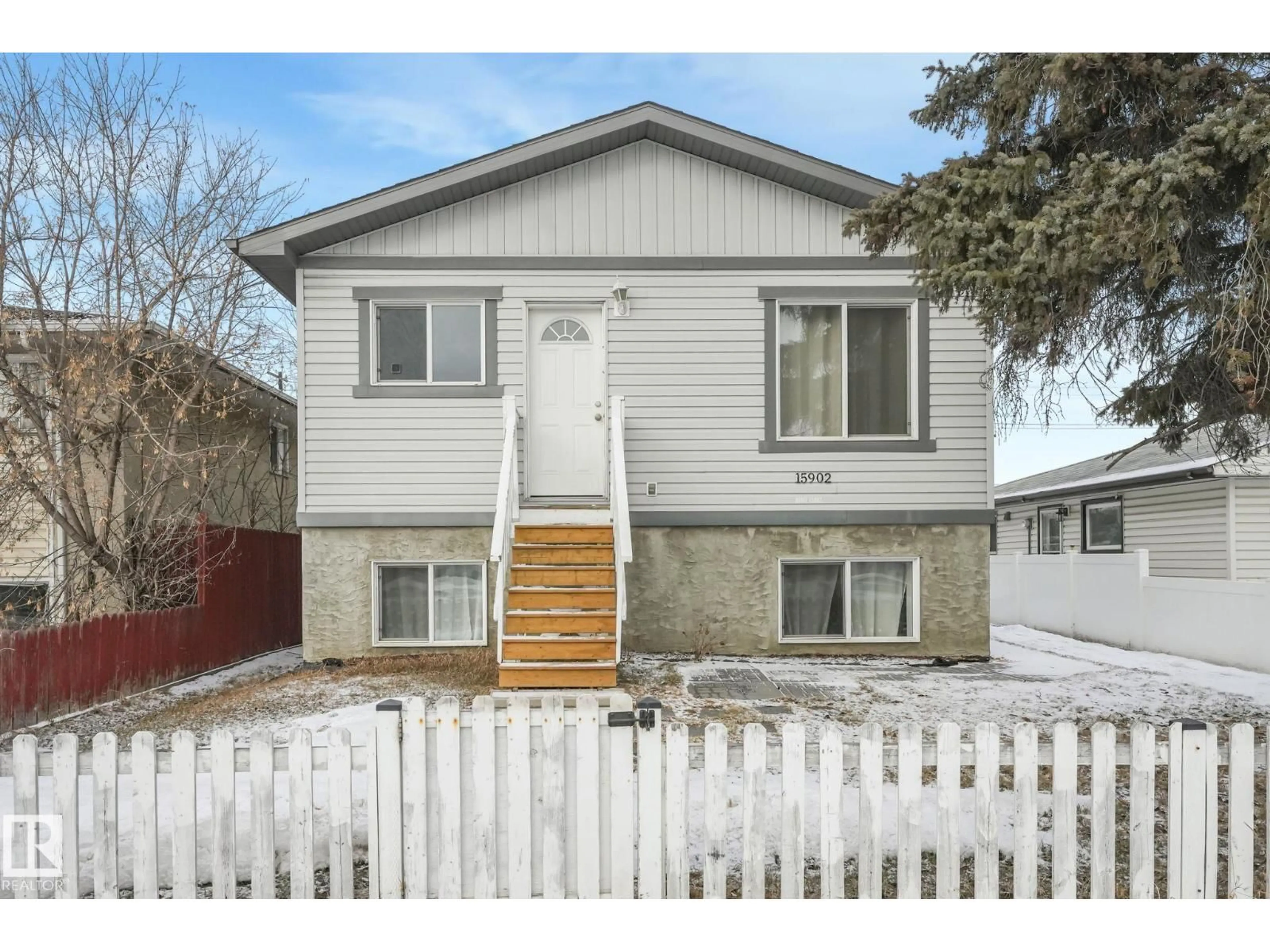 Home with vinyl exterior material, street for 15902 100 AV, Edmonton Alberta T5P0L2