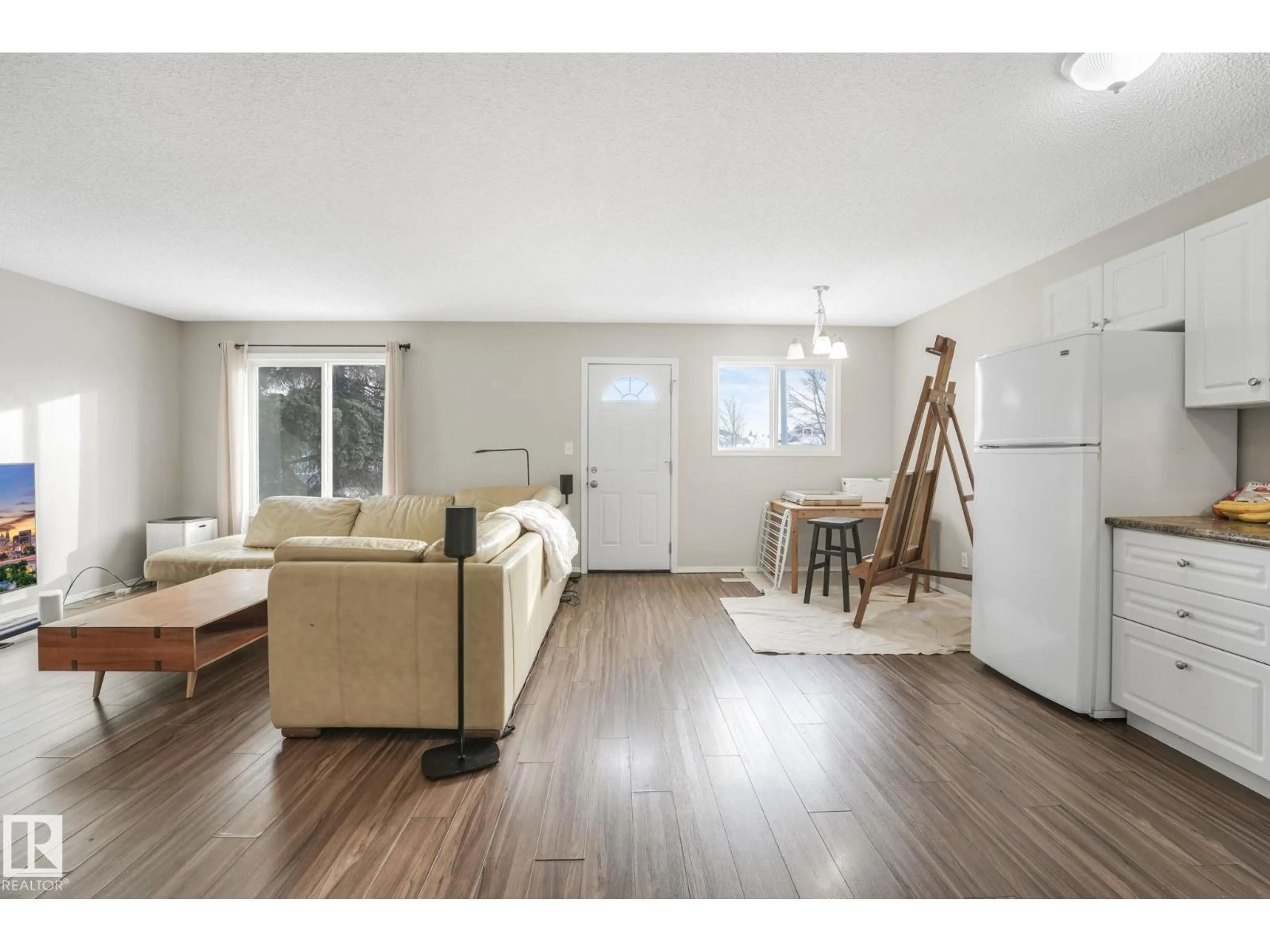 Living room with furniture, wood/laminate floor for 15902 100 AV, Edmonton Alberta T5P0L2