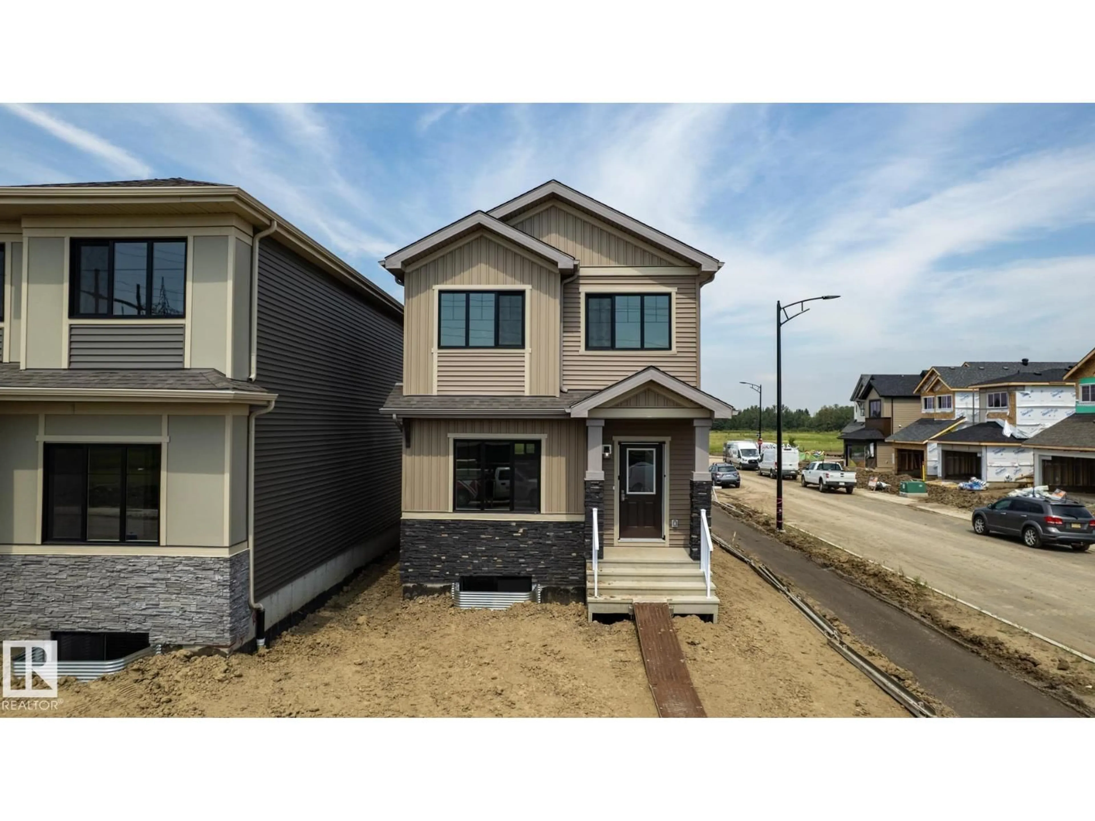 Home with vinyl exterior material, street for 19512 30 AV, Edmonton Alberta T6M1M2