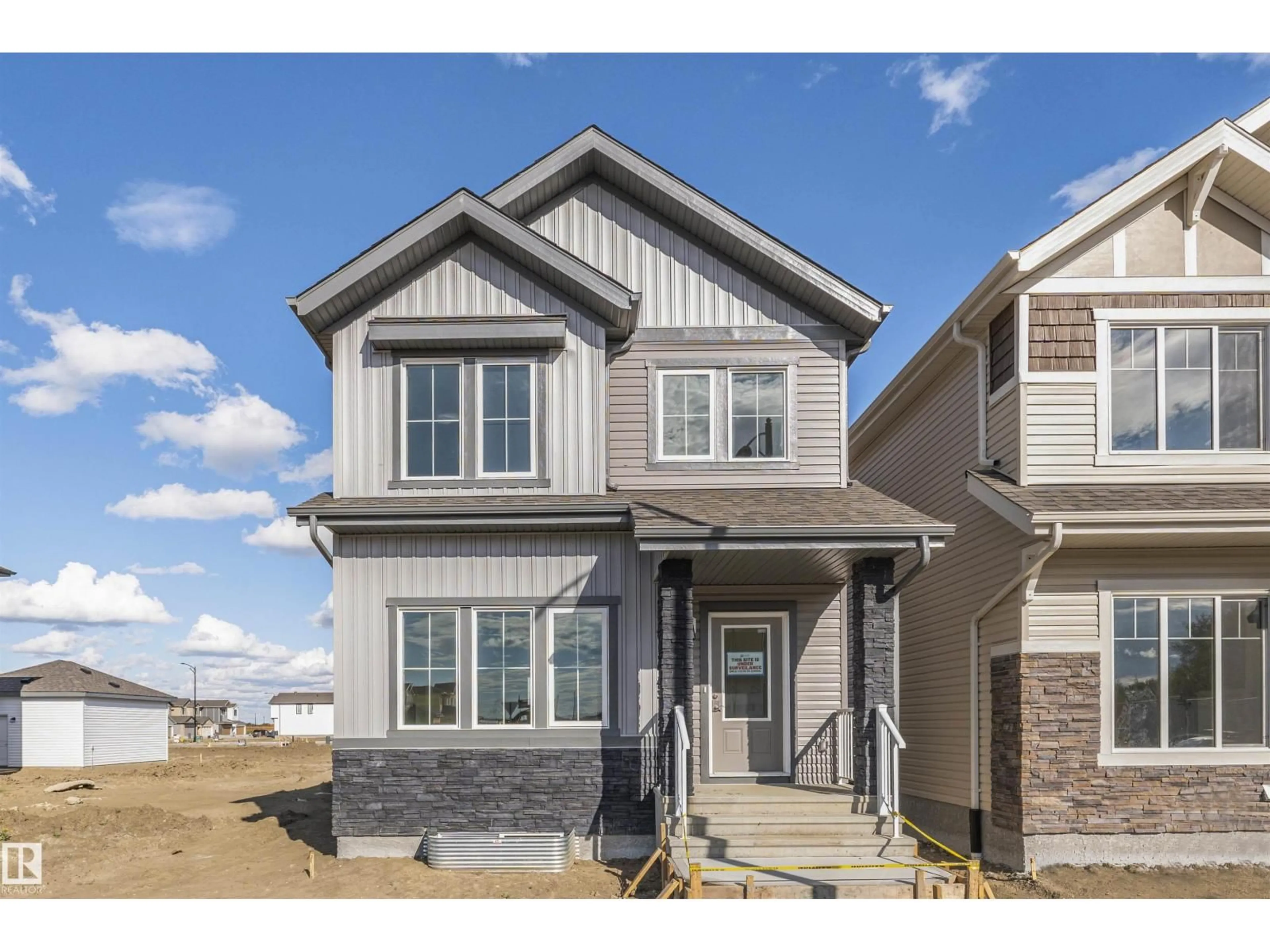 Home with vinyl exterior material, street for NW - 1531 211 ST, Edmonton Alberta T6M2M7