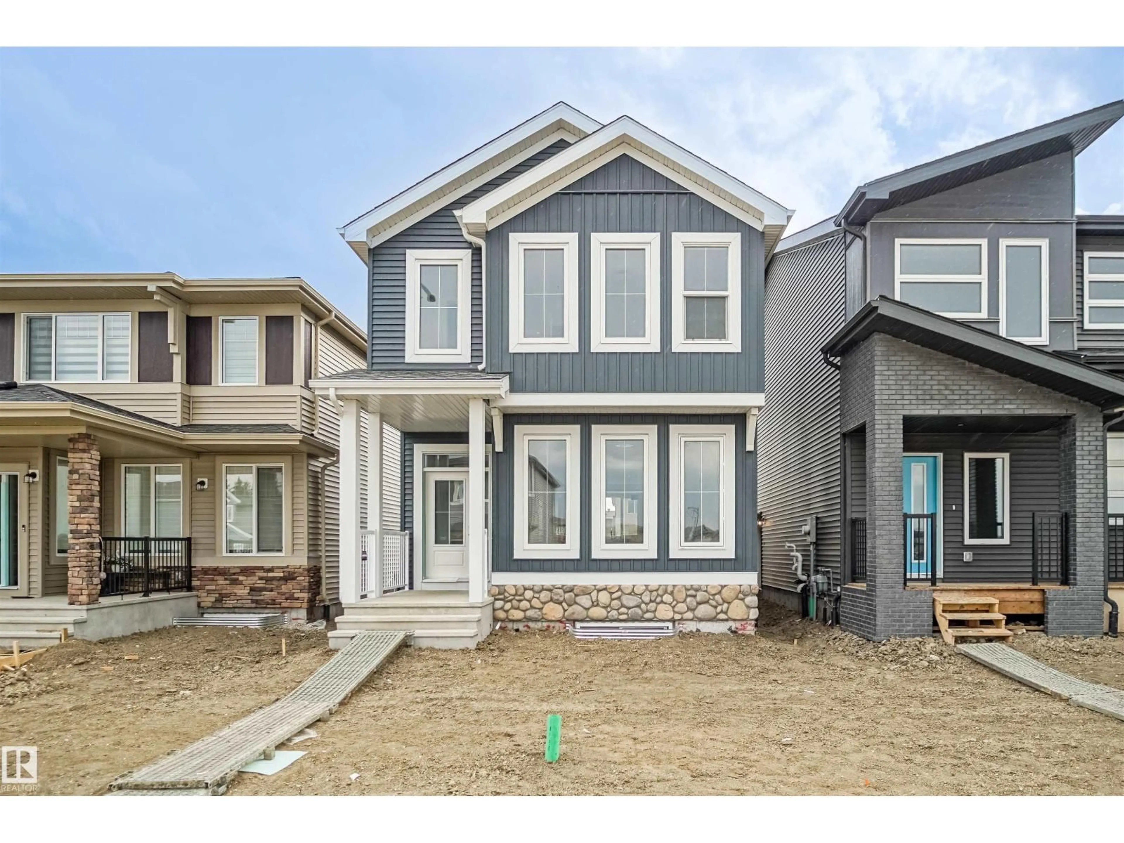 Home with vinyl exterior material, street for 21148 25 AV, Edmonton Alberta T6M2N6