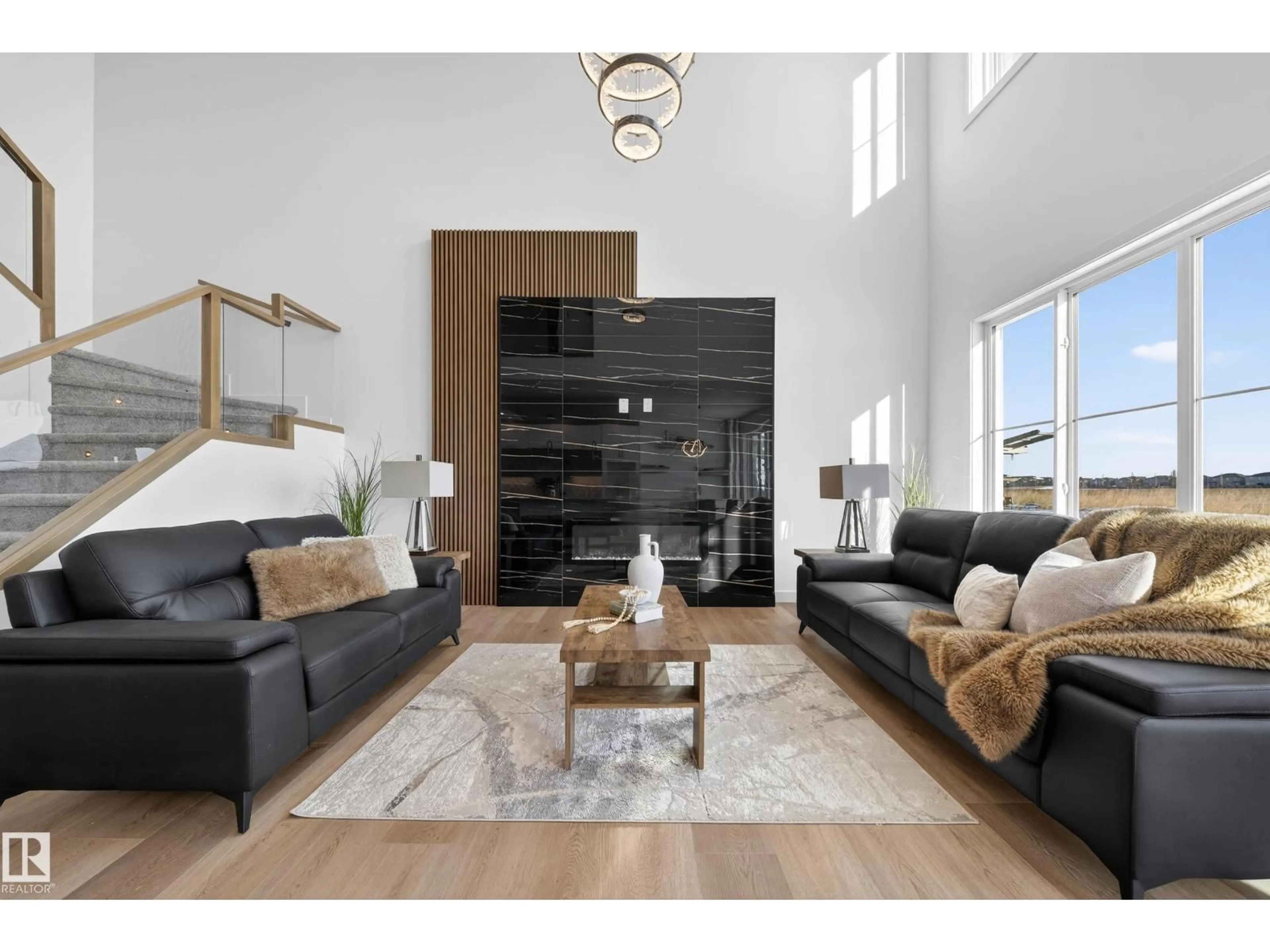 Living room with furniture, wood/laminate floor for 214 CRYSTAL CREEK DRIVE, Leduc Alberta T9E0X6