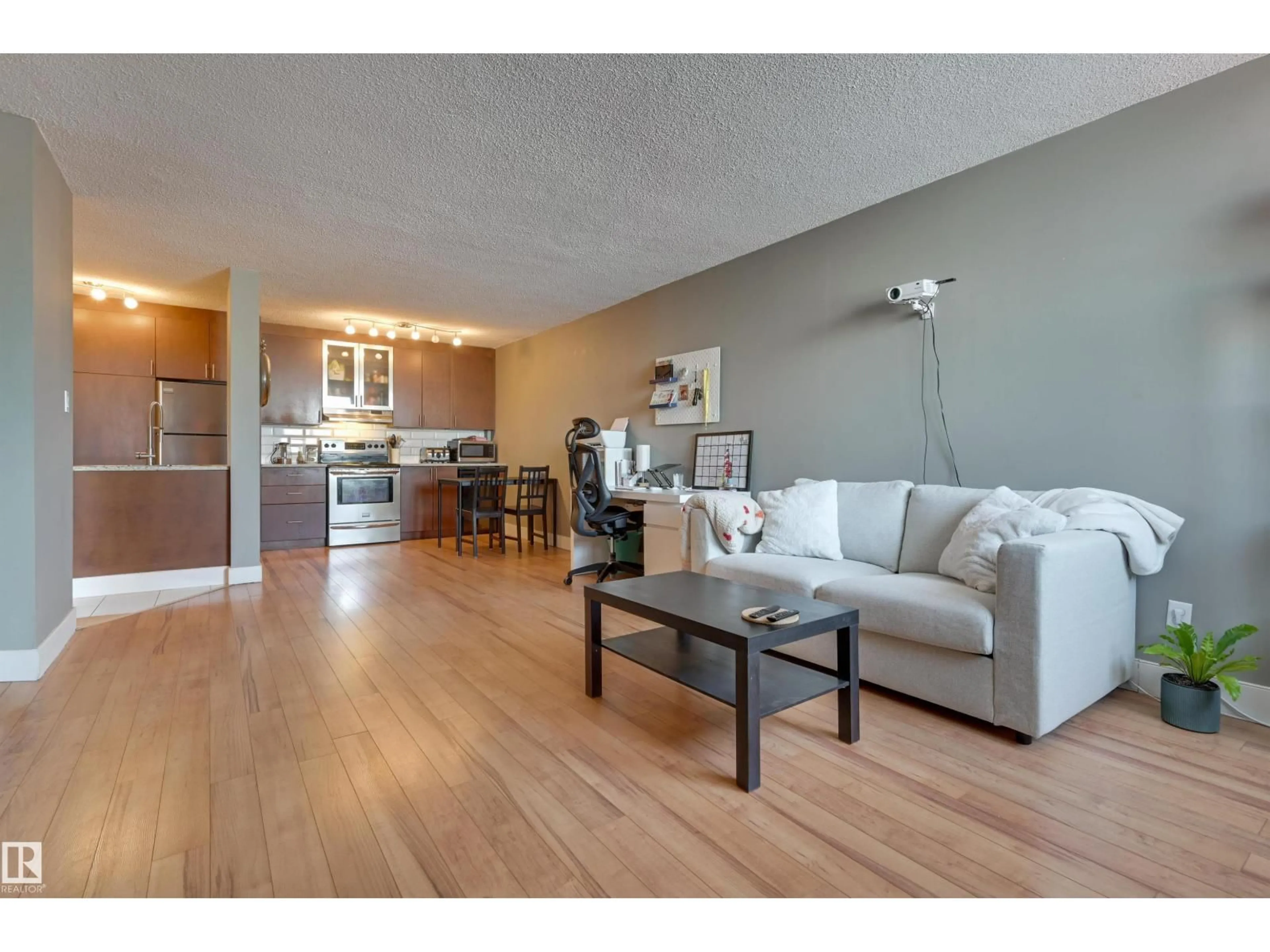 Living room with furniture, wood/laminate floor for 10011 - 1001 116 ST, Edmonton Alberta T5K1V4