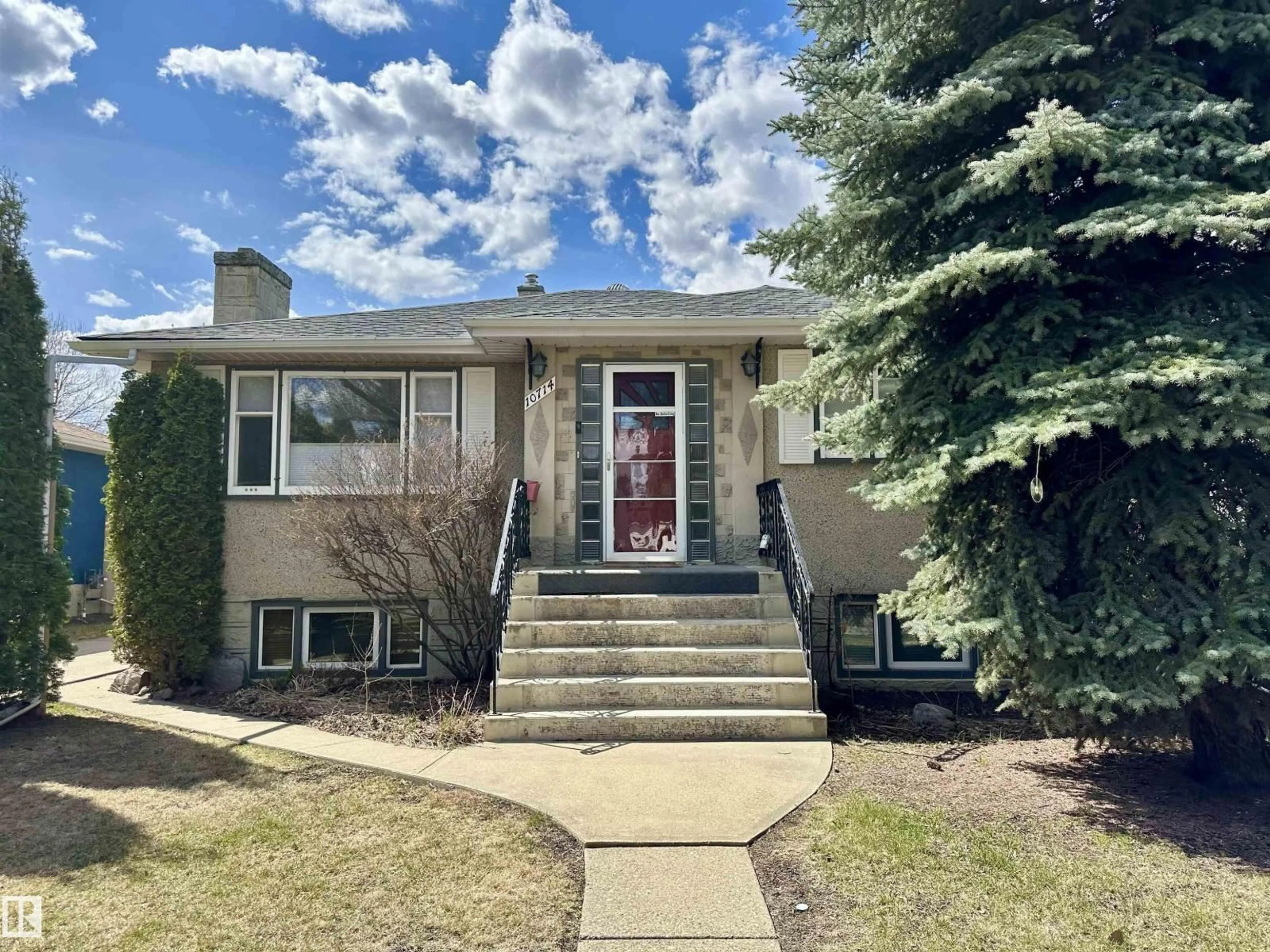 Home with vinyl exterior material, street for NW - 10714 128 ST, Edmonton Alberta T5M0V9