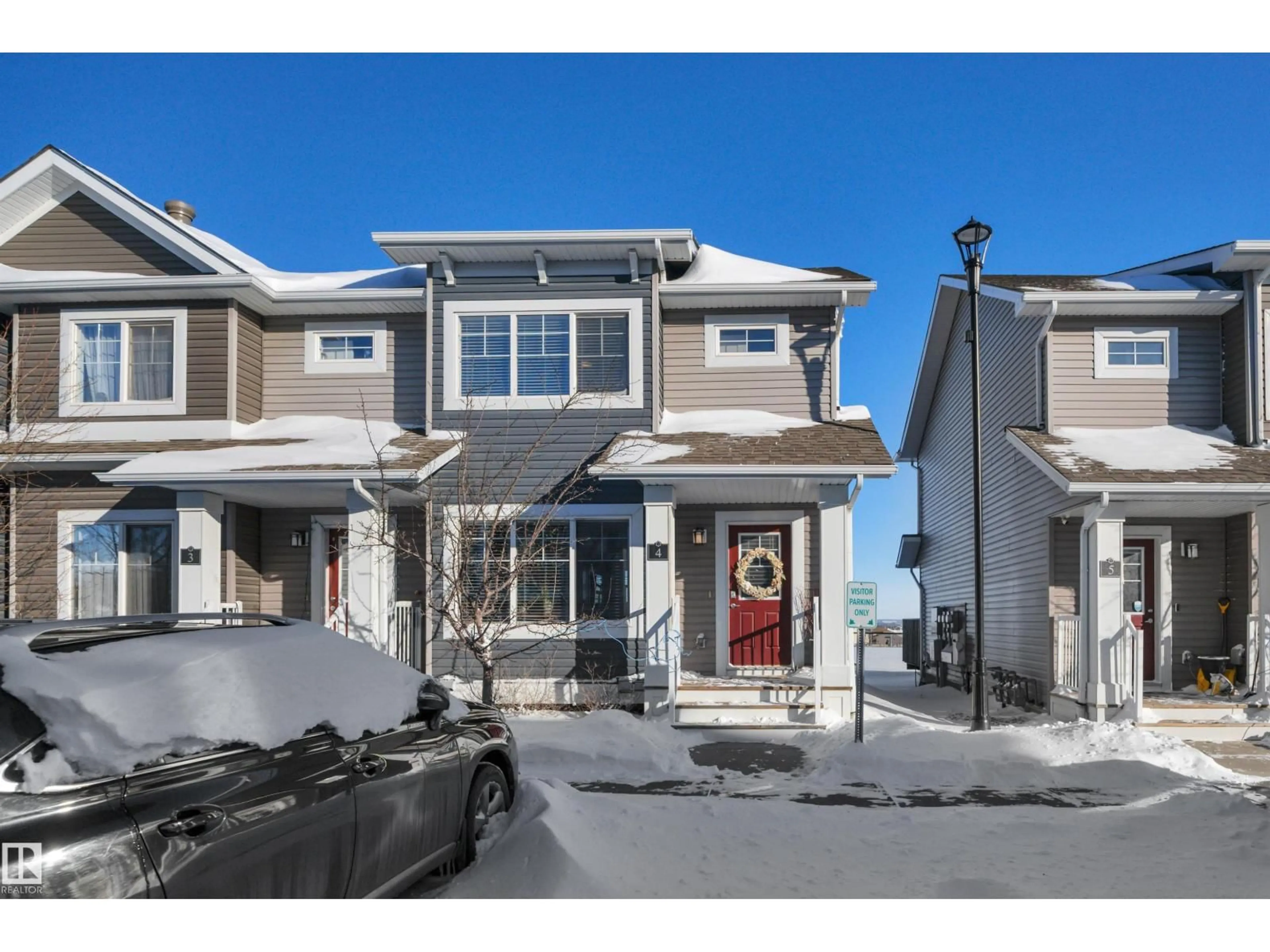 Home with vinyl exterior material, street for #4 - 5203 149 AV, Edmonton Alberta T5A1B5