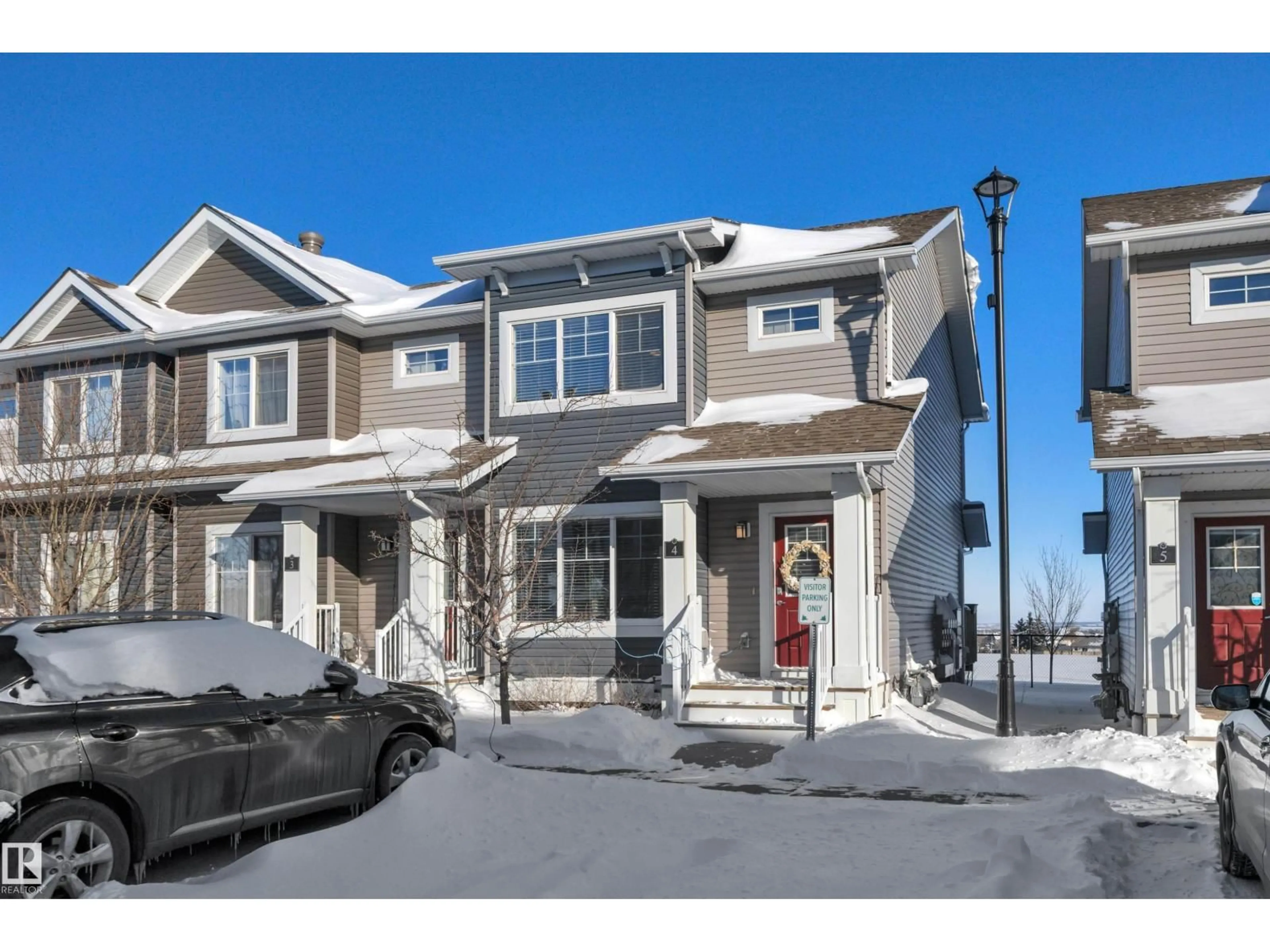 Home with vinyl exterior material, street for #4 - 5203 149 AV, Edmonton Alberta T5A1B5