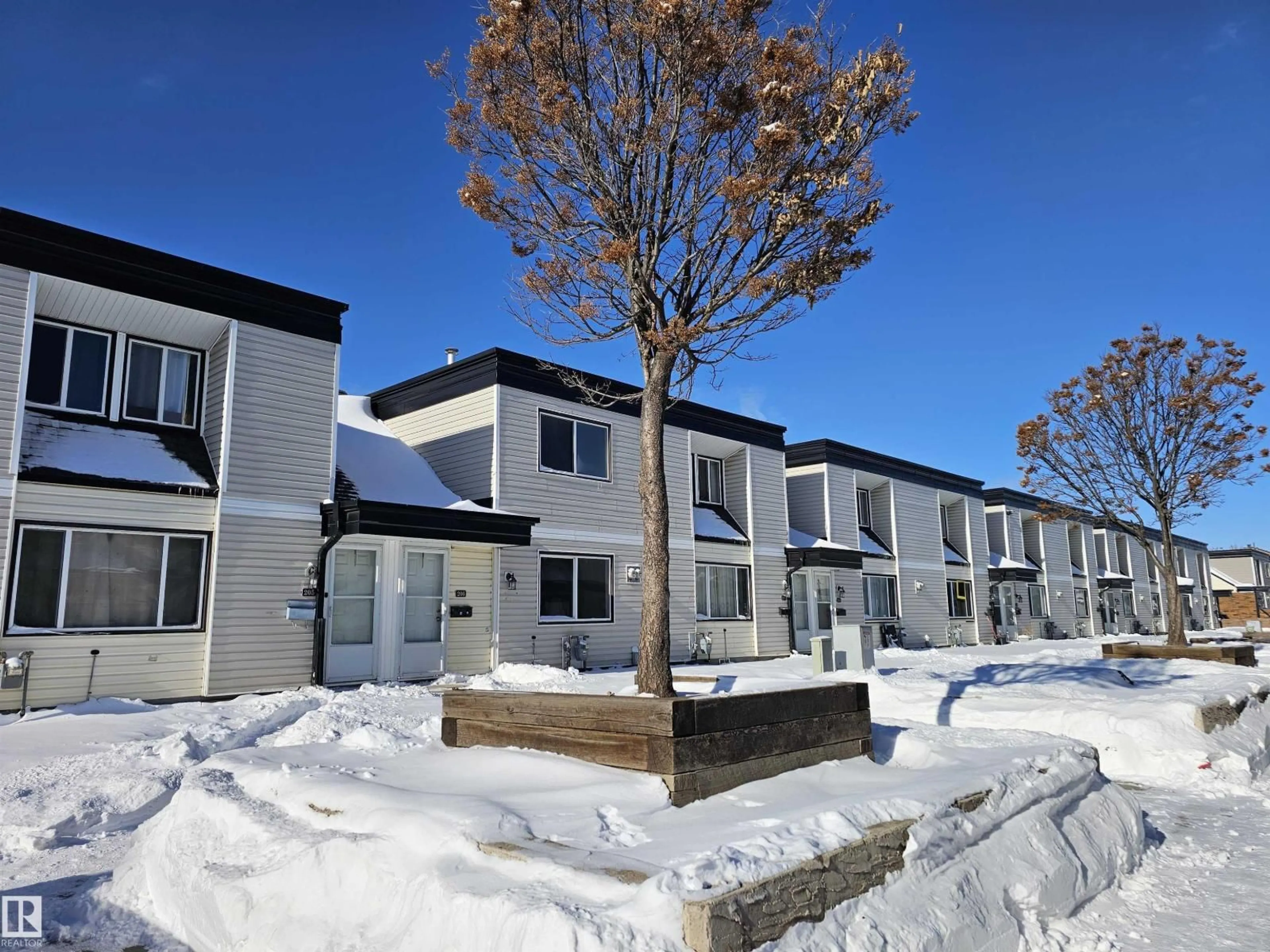 A pic from outside/outdoor area/front of a property/back of a property/a pic from drone, street for 206 - 11421 34ST NW, Edmonton Alberta T5W5J7