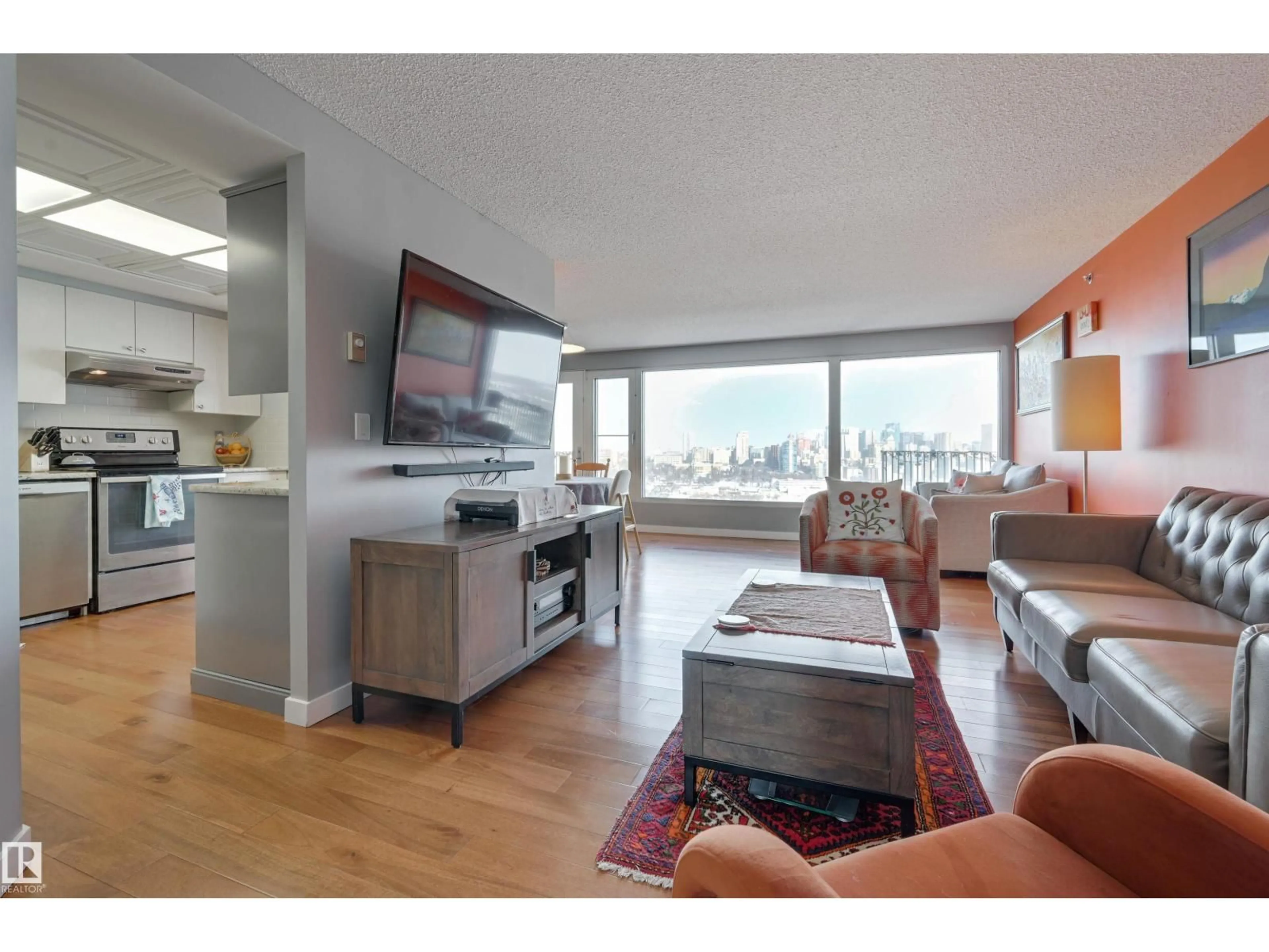 Living room with furniture, wood/laminate floor for 1302 SASKATCHEWAN DR, Edmonton Alberta T6E6J5