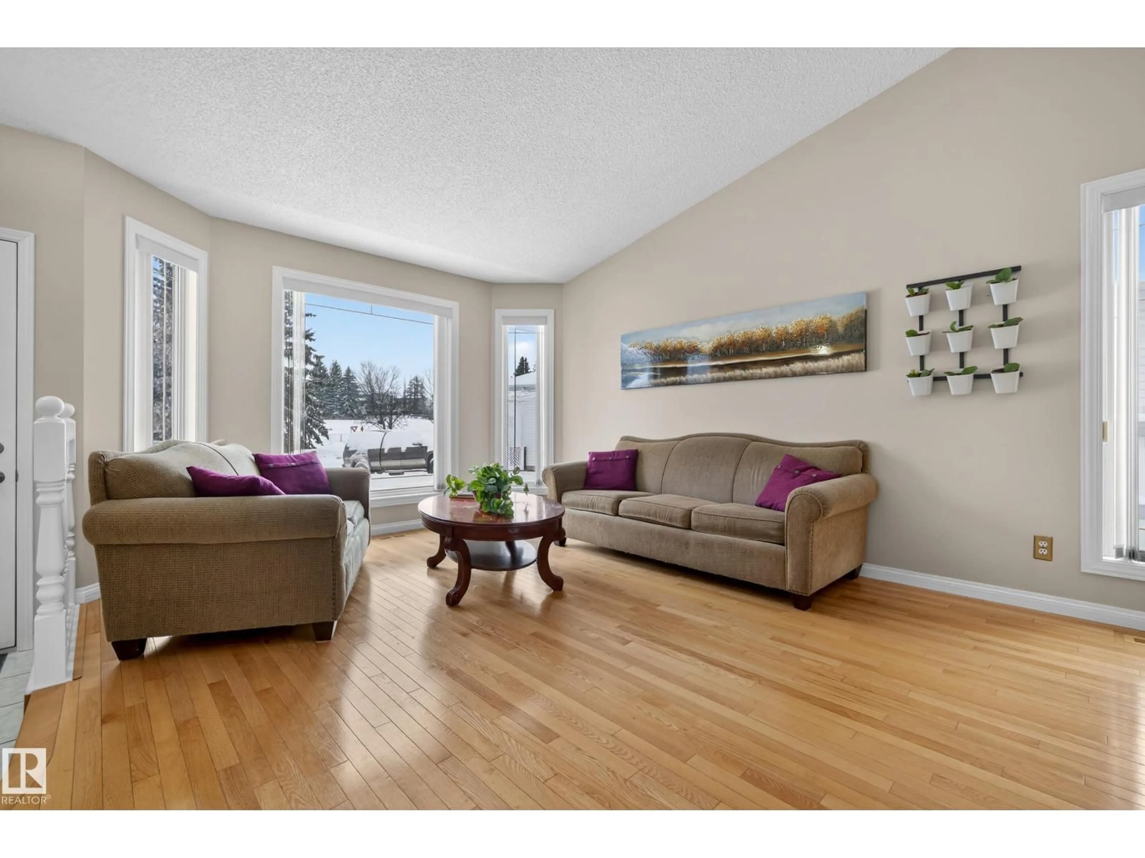 Living room with furniture, wood/laminate floor for 116 HIGHLAND WY, Sherwood Park Alberta T8A5M6