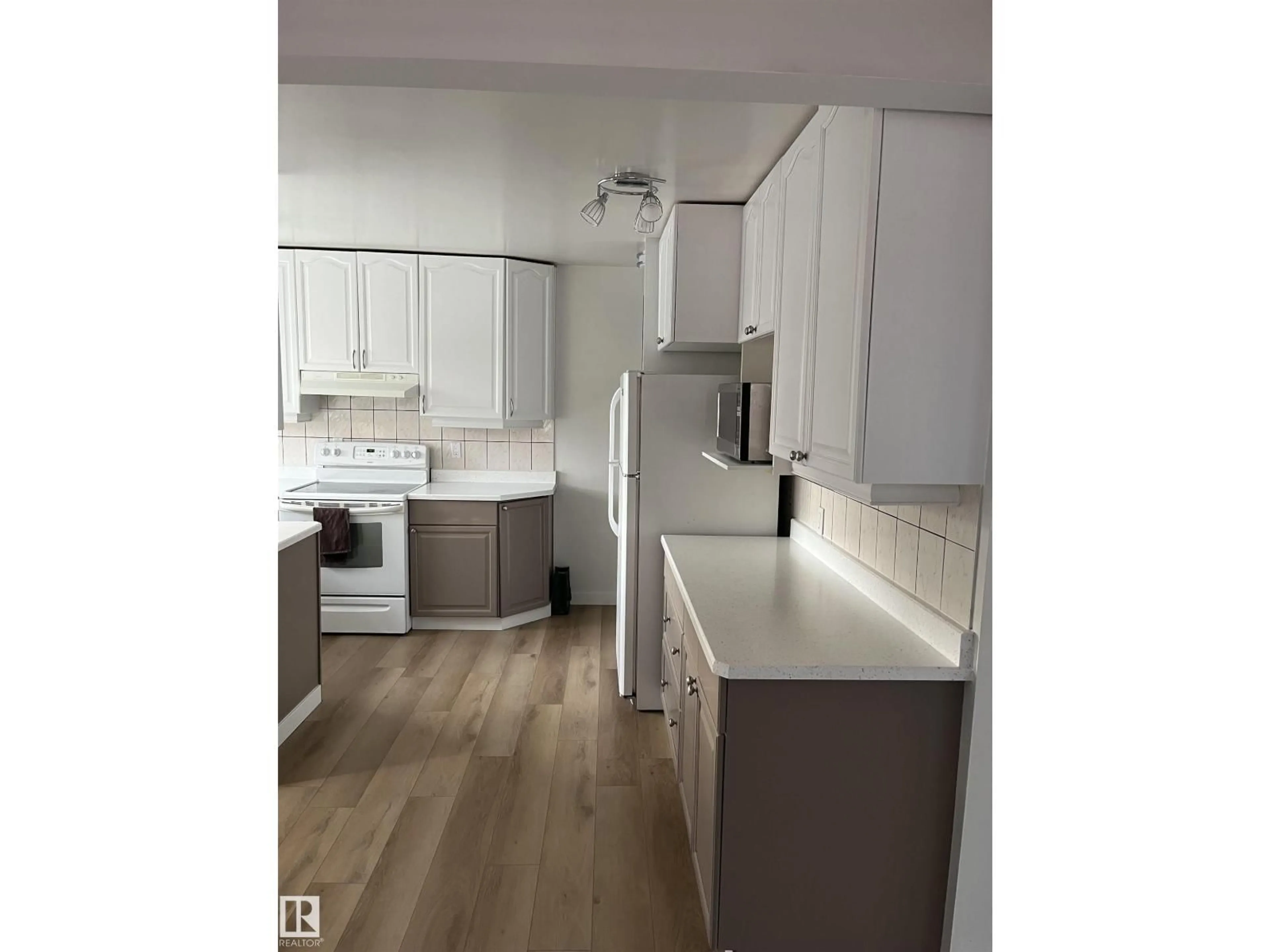 Open concept kitchen, wood/laminate floor for 4508 44 AV, Stony Plain Alberta T7Z1J2