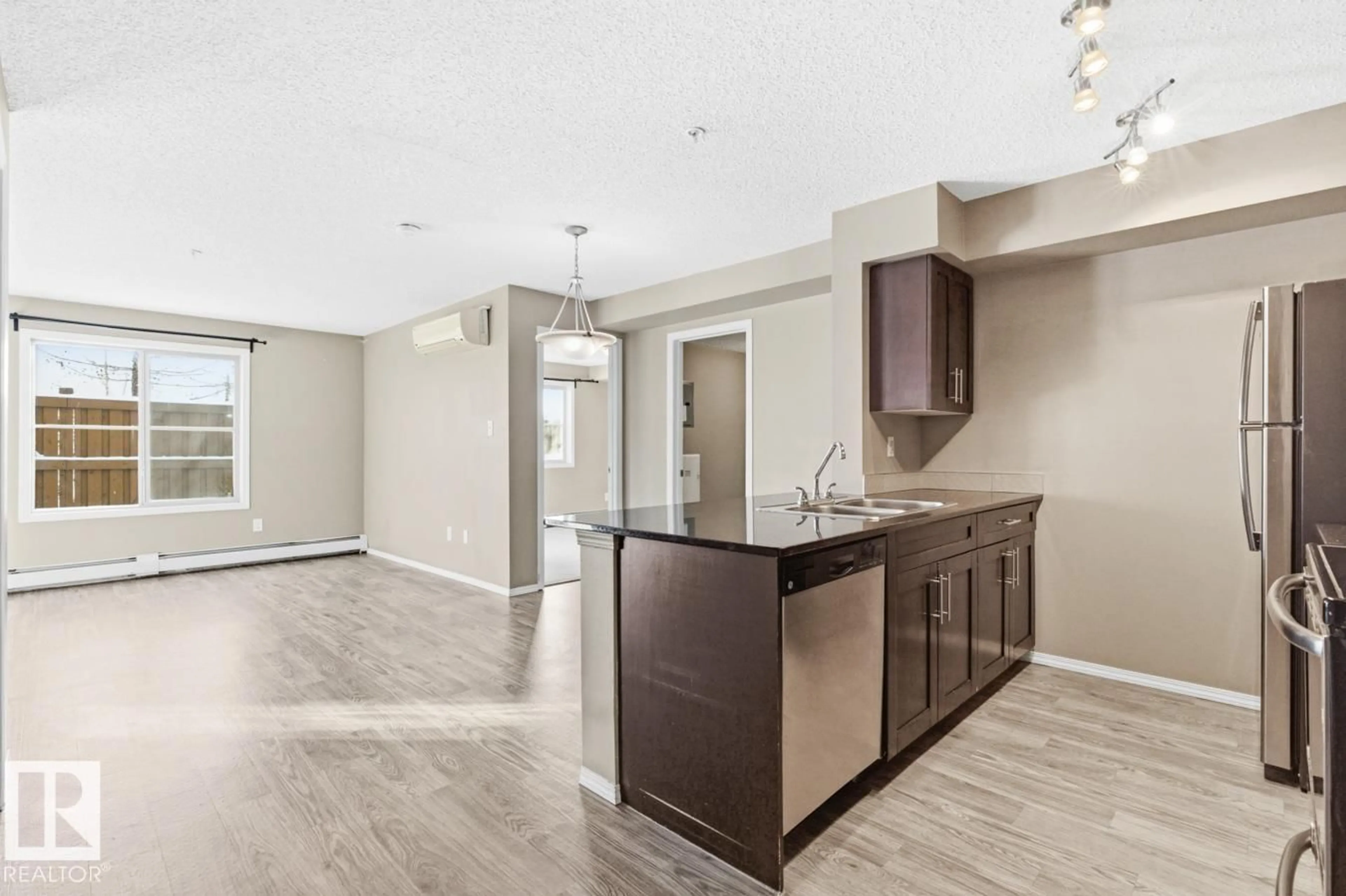 Open concept kitchen, unknown for #117 MCCONACHIE DR, Edmonton Alberta T5Y3N4