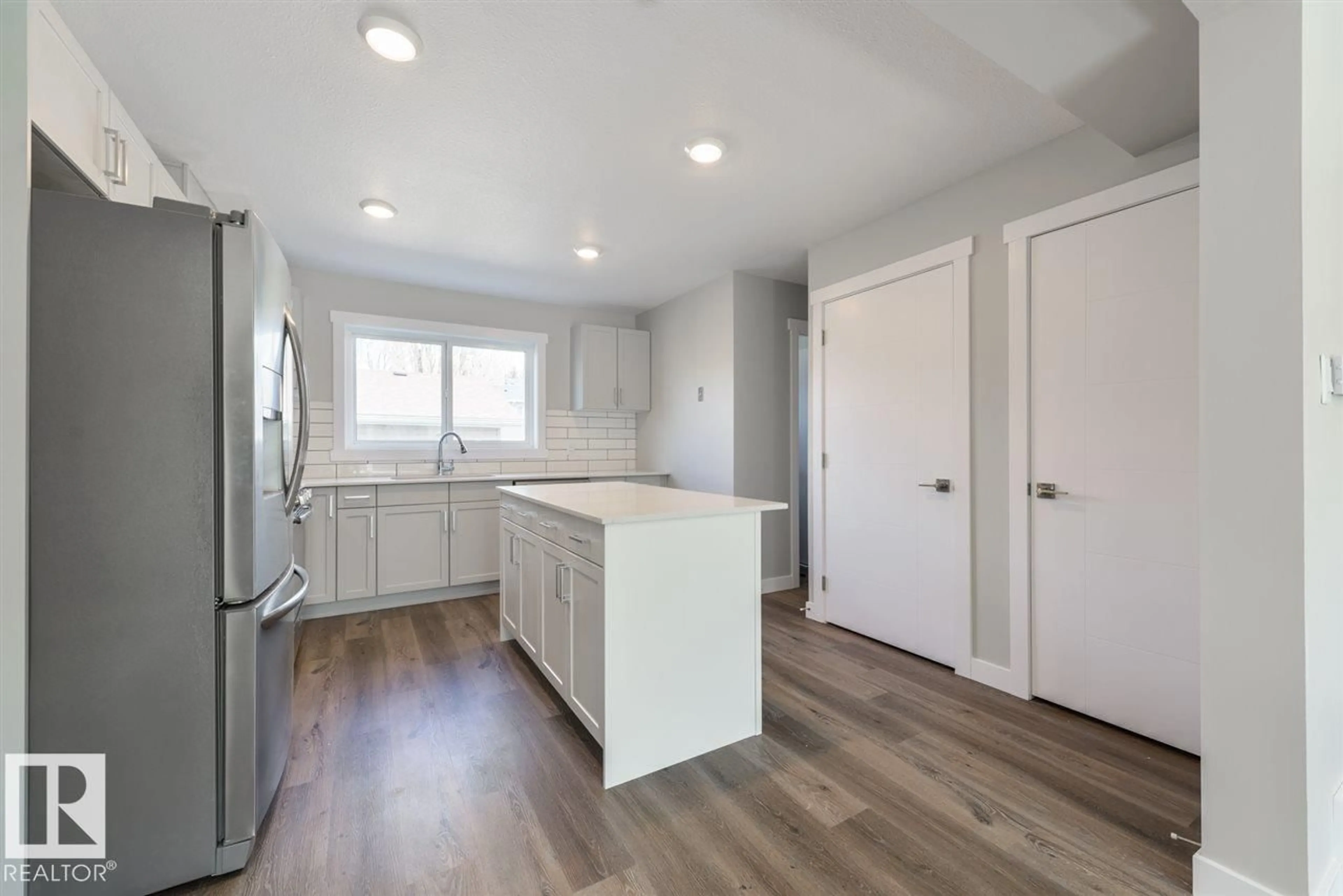 Open concept kitchen, unknown for NW - 7940/7942 82 AV, Edmonton Alberta T6C0Y2