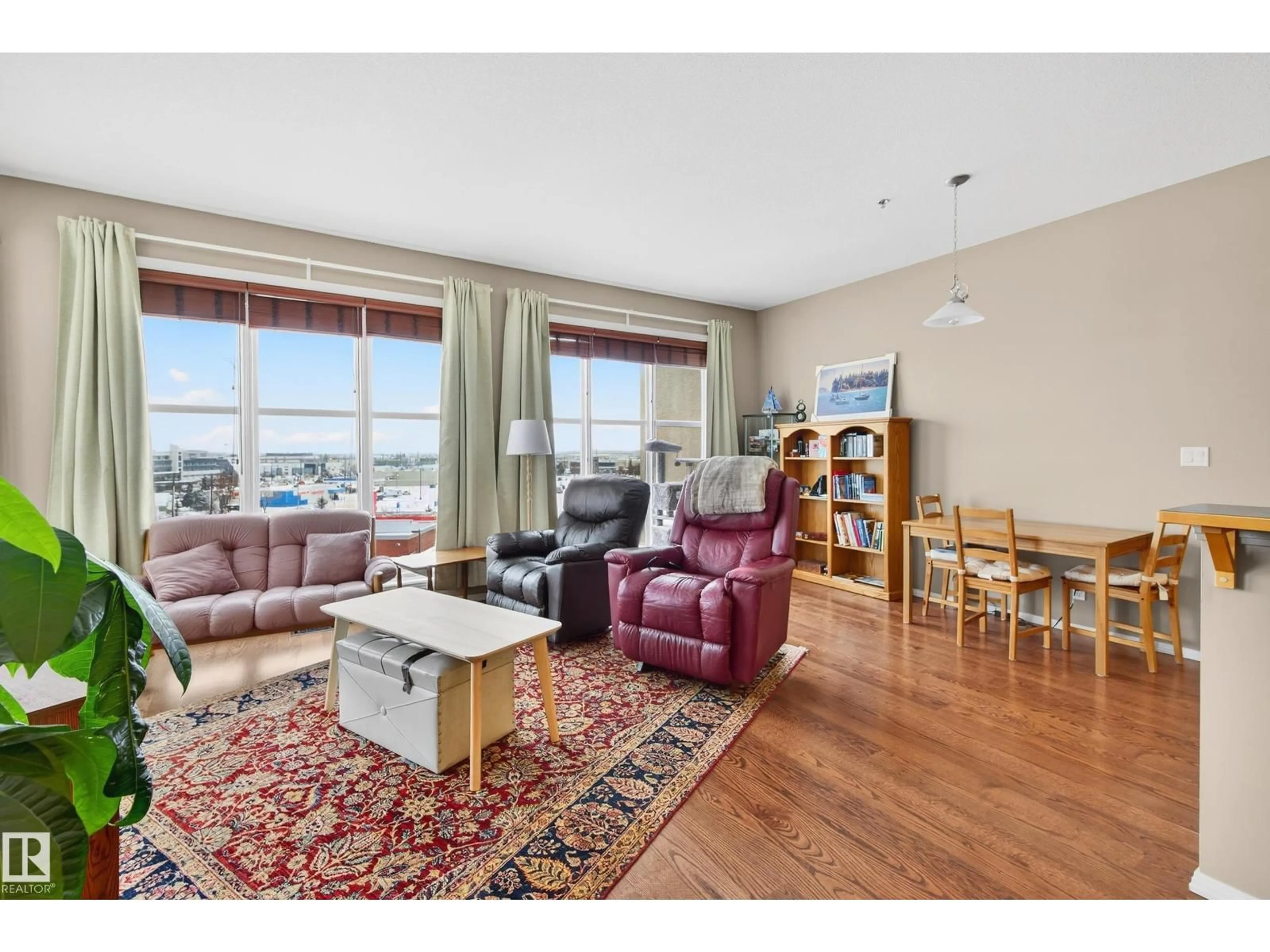 Living room with furniture, wood/laminate floor for 506 - 4835 104A ST, Edmonton Alberta T6H0R5