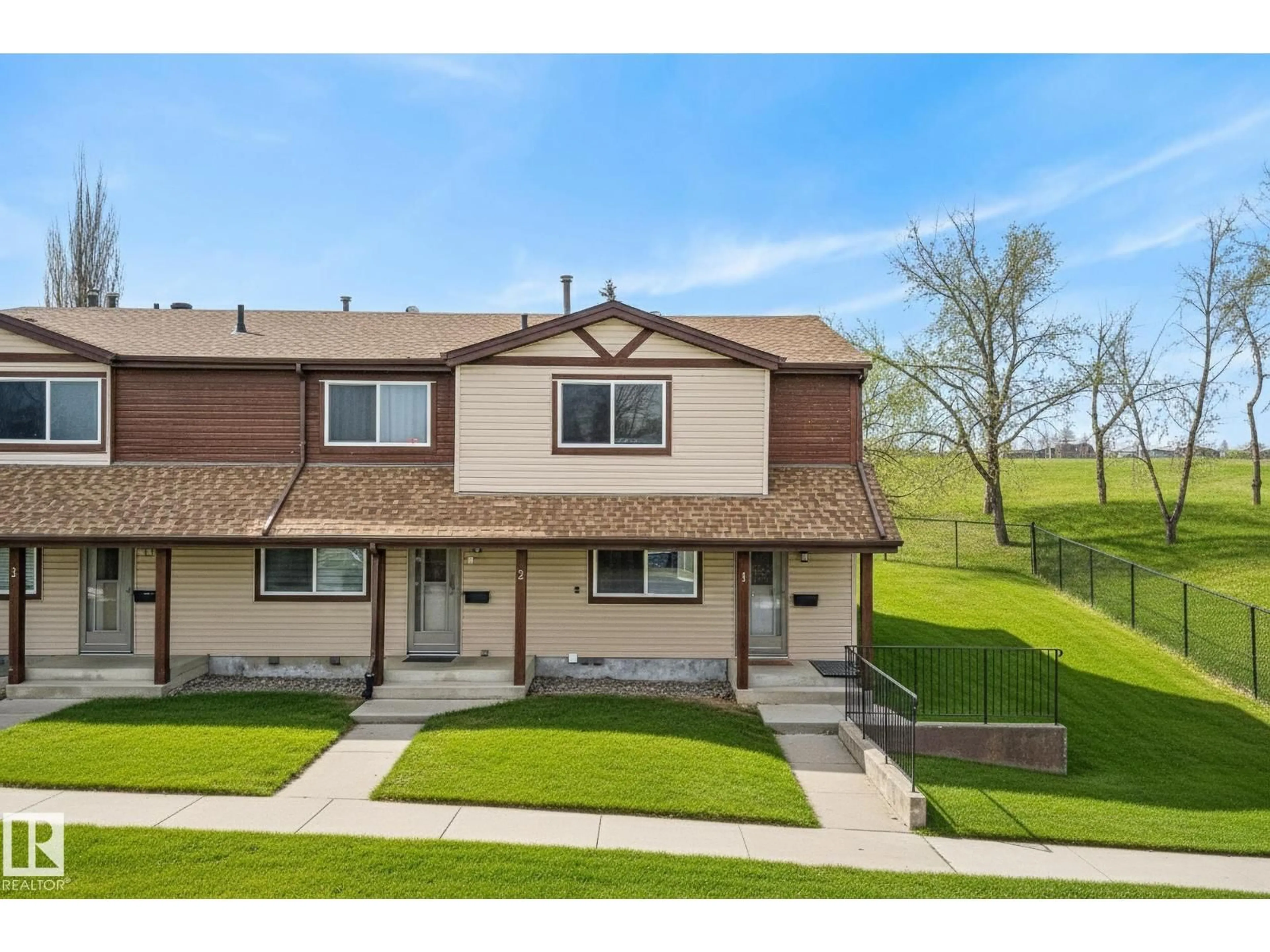 Home with vinyl exterior material, street for 13833 30 ST, Edmonton Alberta T5Y2B2