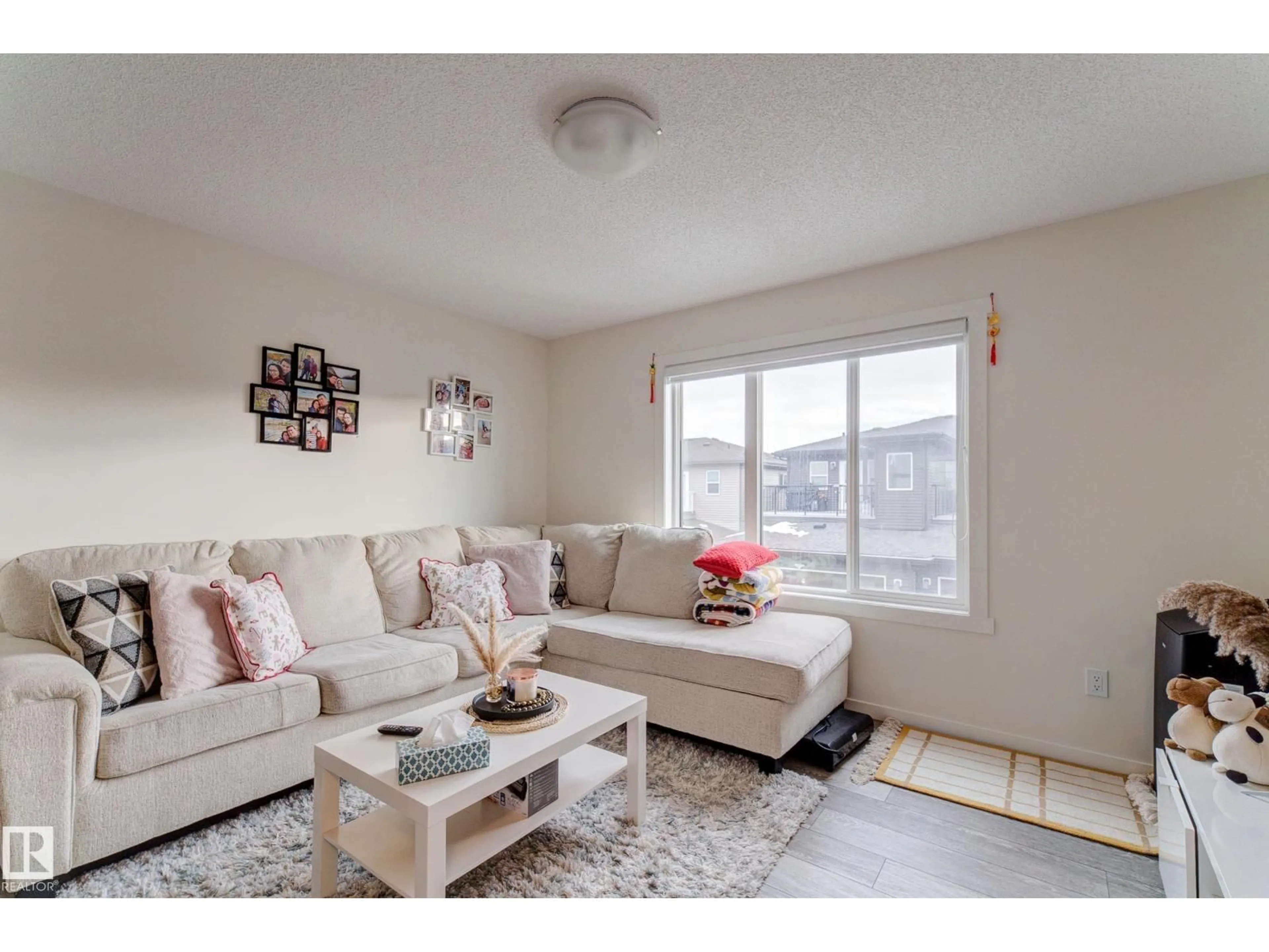 Living room with furniture, unknown for NW - 19713 28 AV, Edmonton Alberta T6M1M1
