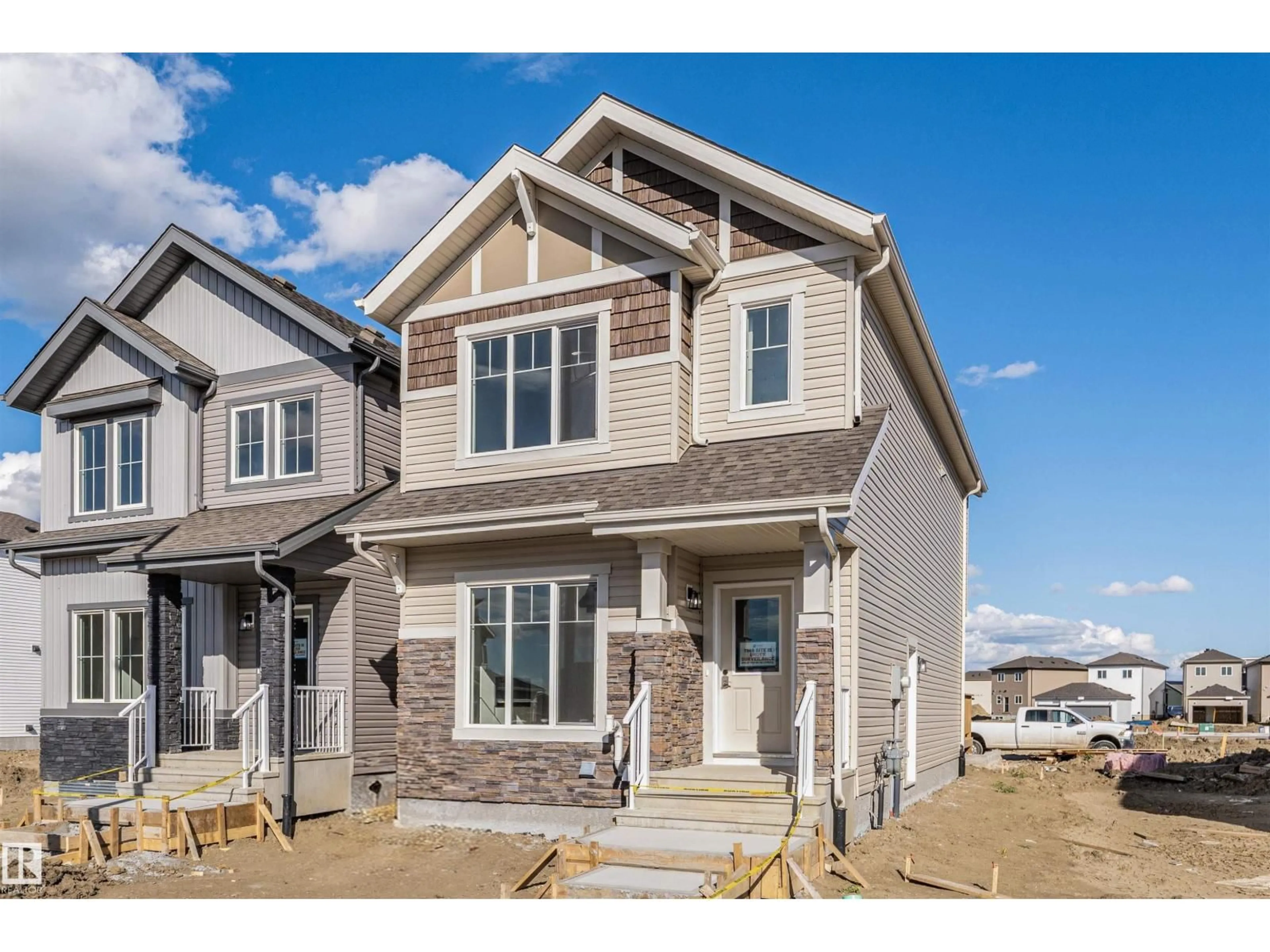 Home with vinyl exterior material, street for NW - 1535 211 ST, Edmonton Alberta T6M2M7