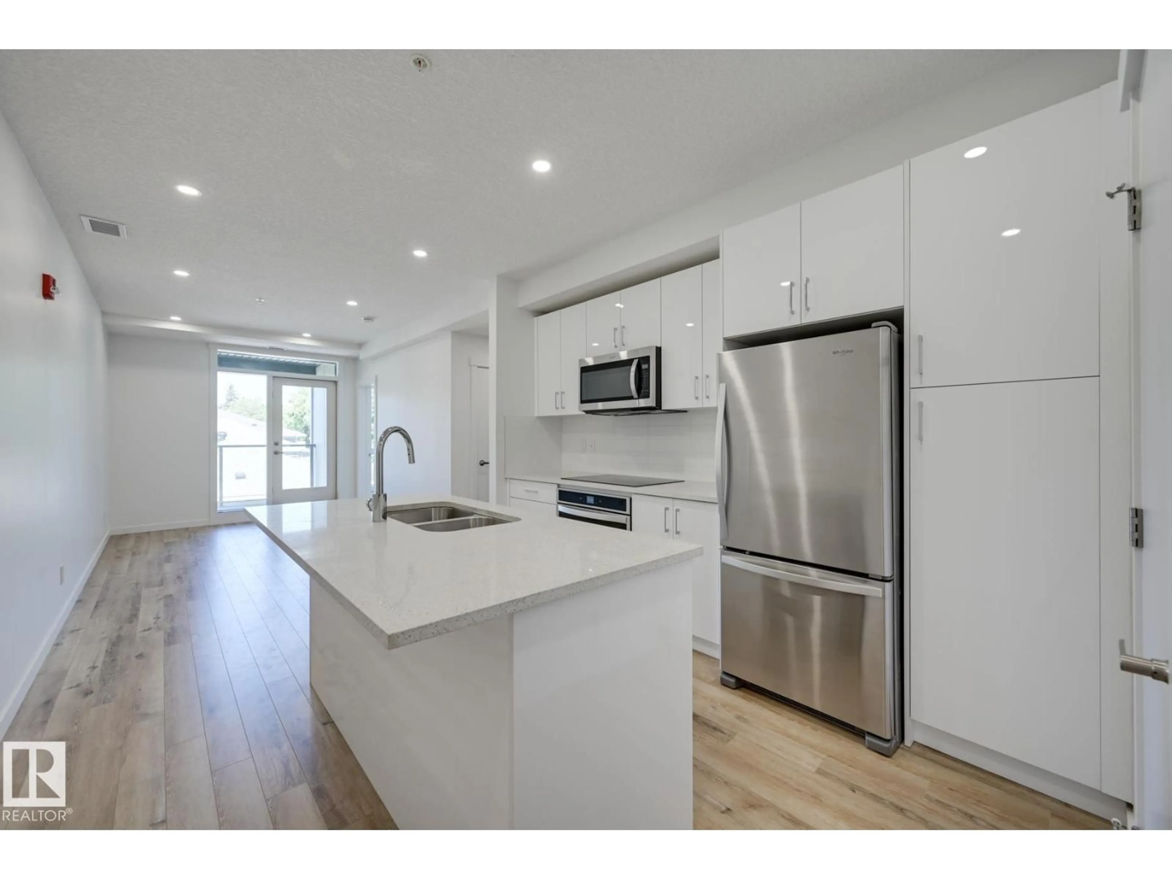Open concept kitchen, wood/laminate floor for 313 - 11503 76 AV, Edmonton Alberta T5G0K6
