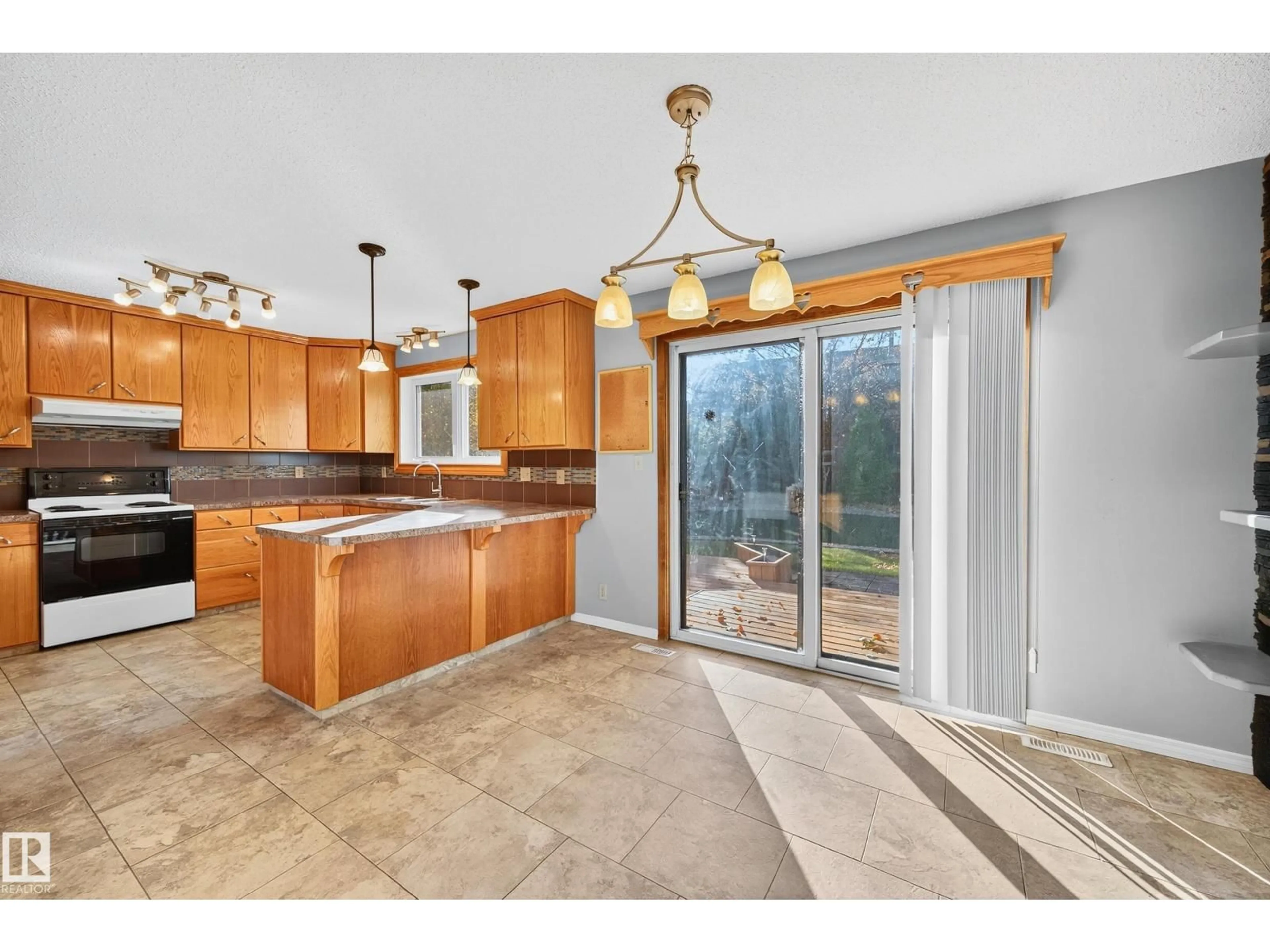 Open concept kitchen, ceramic/tile floor for 3917 43 AV, Leduc Alberta T9E4V6